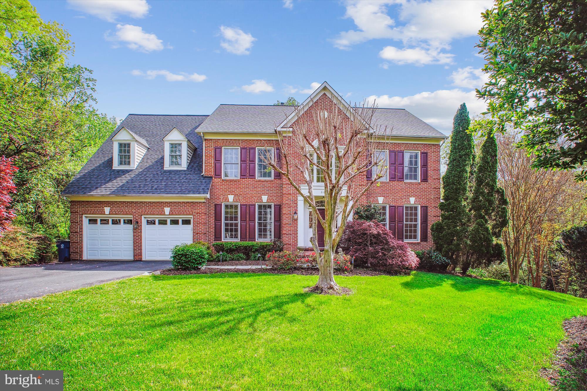 Beautifully designed classic Colonial home in a fantastic location, close to the heart of McLean at the end of a quiet cul-de-sac in prestigious Brynmawr Heights (no HOA). This 5-Bedroom home with 4 Full Baths plus Powder Room is bordered by parkland on one side yet is conveniently close to the center of McLean for restaurants and shopping.  The private back yard features a stepping stone path leading down to a charming stream which flows into the stream in neighboring Pimmit Run Park .....The MAIN LEVEL features a perfect floor plan with a 9 foot ceiling.... Enter this home via the two-story Foyer with a marble floor and you'll find a spacious Living Room, private Den / Office, large Dining Room, open Kitchen with stainless appliances, granite counters and central Island with a Wolf, 4 burner gas cook-top. The casual dining space flows to the large Family Room with wood burning fireplace and a ceiling fan. You'll find solid oak hardwood floors in all the main rooms on this level. The beautiful 4-season Sunroom addition was added in about 1999, featuring 4 skylights in the cathedral ceiling, a ceiling fan , 3 window walls and a ceramic tile floor. A Powder Room is conveniently located off the Foyer and the Laundry Room is located next to the entrance to the 2-car Garage.  The Garage features 2 door openers and wiring for an EV charger.  Access the huge upper deck on the back of the house, directly from the Family Room.... The UPPER LEVEL features the incredible Primary Bedroom with a separate Sitting Room, 2 walk-in closets and a wonderfuly large Primary Bath with step-in shower plus a jetted tub, private water closet and double sink vanity. You'll find 3 more bedrooms on the upper level (one with a private full bath) and a full Hall Bath at the end of the open hallway.  New carpets have been installed in all the bedrooms on this level.  All 4 upper level bedrooms have a ceiling fan and the entire interior was recently painted.... The LOWER LEVEL features two large Family Rooms, the 5th Bedroom, the 4th Full Bath, a huge Storage Room with plentiful shelving, two hanging closets, a wine rack and a wine cooler. You'll access a second huge Deck via a door from the Family Room.....  This property checks all the boxes for a solid, highly-desireable long-term home with great public and private schools.... Ideal for entertaining and also a great place for every-day, low-maintenance living with a front yard sprinkler system and exterior lighting..... The Sellers welcome your offer to purchase and can settle very quickly, so don't delay.