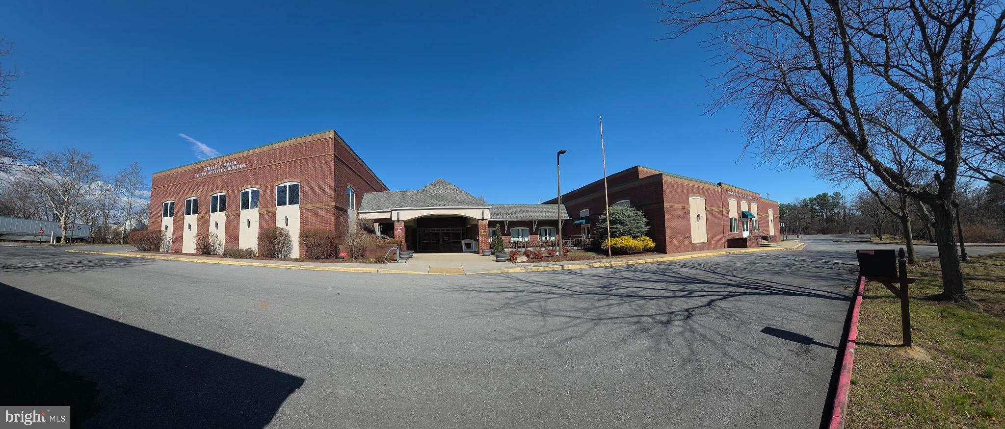 Rare opportunity to own a 22,320 sq. ft. indoor sports and entertainment facility situated on 3 acres with Industrial zoning. Formerly a youth development center, the building features two gymnasiums, a theater area, multiple kitchens with dining spaces, and several large restroom areas. The flexible layout supports single-tenant or multi-tenant use, making it ideal for recreational, institutional, or commercial operations. The property also offers extensive on-site parking and excellent potential for adaptive reuse. Unique large-scale facility with a wide range of possible uses.