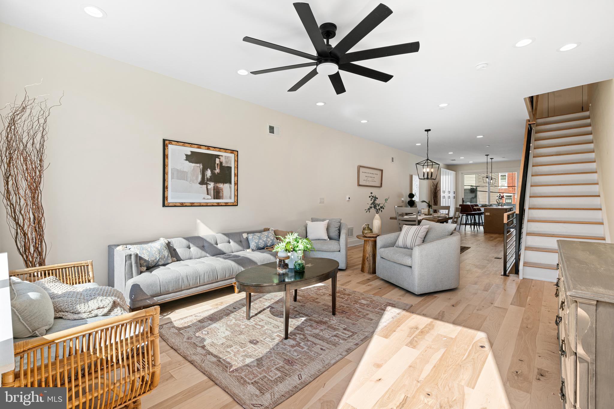 Welcome to 2623 Reed Street, a brand-new construction home ideally located in the heart of Grays Ferry. This thoughtfully designed residence offers around 2,800 square feet of modern living space spread across three stories, including a finished basement and a private rooftop deck with stunning views of the Philadelphia skyline. The exterior features timeless red brick with black-trimmed windows and iron railings, providing classic curb appeal with a contemporary edge. Inside, the open-concept main living level is flooded with natural light and showcases hardwood floors, sleek cabinetry with striking tan lower cabinets, a large island, and high-end appliances.  The upper levels include spacious bedrooms, ample closet space, and spa-inspired bathrooms with custom tilework and modern finishes. The third-floor primary suite features a luxurious walk-in closet and direct access to the pilot house leading to the expansive rooftop deck, ideal for entertaining or relaxing above the city. Additional highlights include a finished basement with laundry and utility space, energy-efficient systems, and a full sprinkler system for added safety. Located just moments from Point Breeze, Graduate Hospital, and University City, this home offers convenient access to parks, dining, public transit, and major highways. 10-year tax abatement.