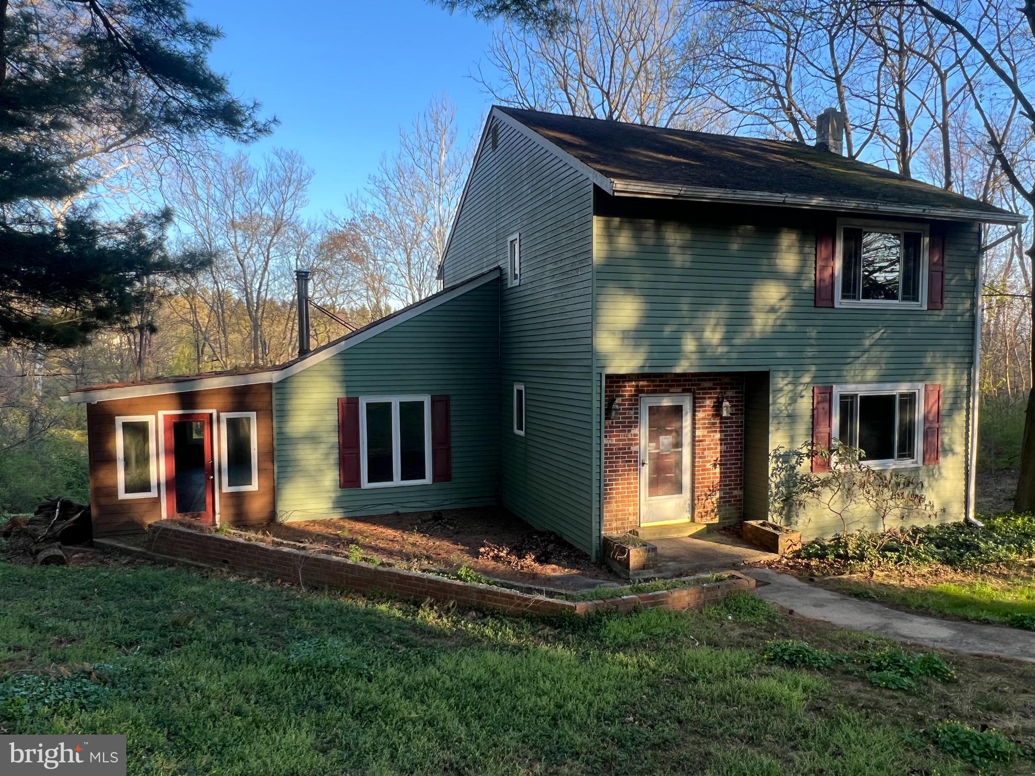 Now is your opportunity to purchase a home that needs cosmetics with a storybook address (7 Shady Lane)!  
This 3 bedroom 1.5 bath home is situated on 2 lush acres at the end of a quiet cul-de-sac.  Featuring a very livable floorplan with living room, dining room, kitchen  and family room on the first floor and 3 bedrooms and 1 full bath on the second.  The compact floorplan is enhanced by a generous sunroom spanning the majority of 2 sides of the home and a rear deck to relax and enjoy the tranquil views.  Basement is unfinished.  Dont wait on this one,   Bring your creative ideas to update this property and create your forever home.  Home needs considerable work.  Cash , Private money or reno loan buyers only.