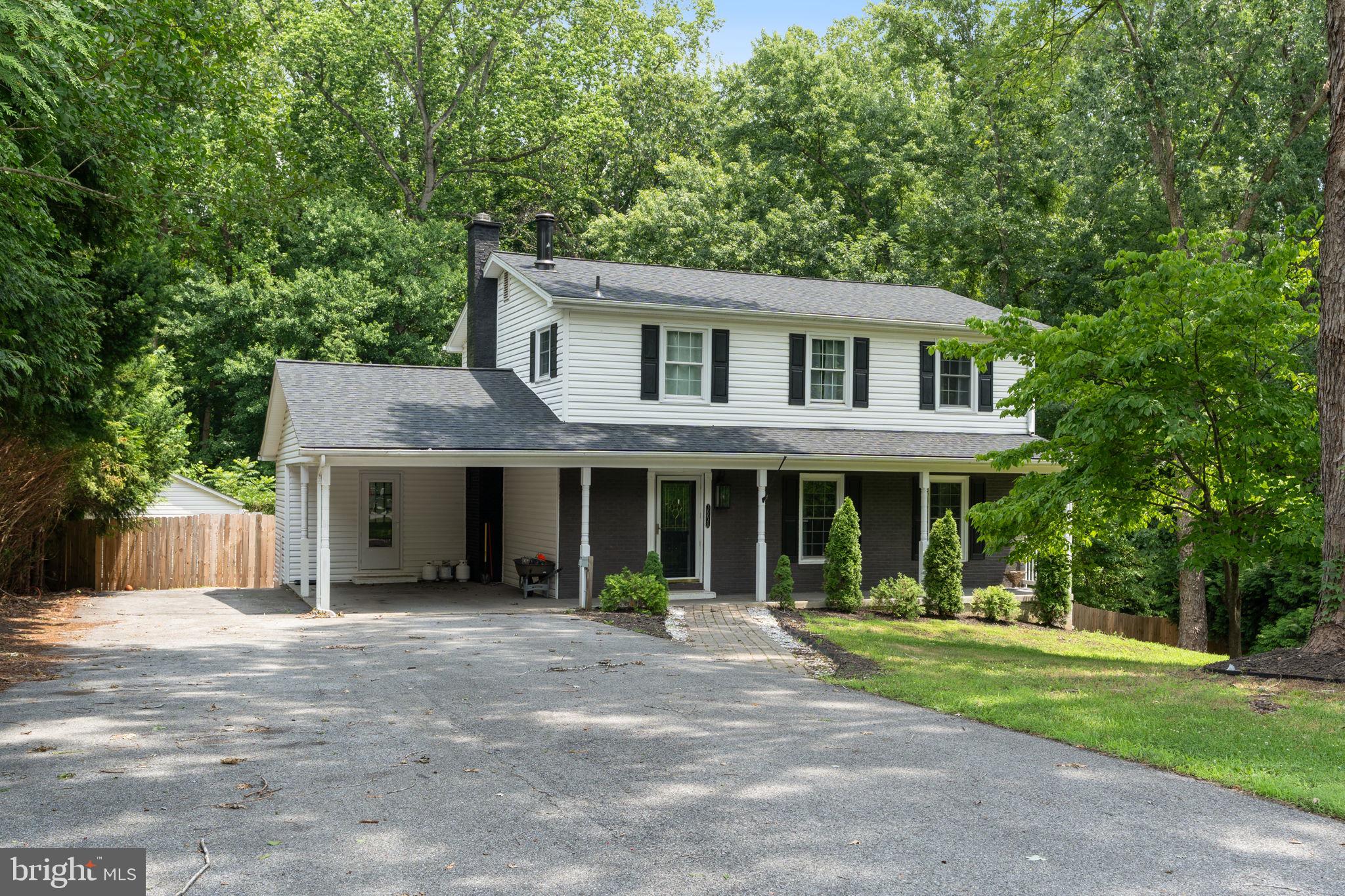 PRICED TO SELL! Privacy and Southern Maryland charm come together on nearly 1.5 acres at the end of a peaceful cul-de-sac. This tree-lined property creates a secluded retreat just 2 miles from the beach and features an impressive ¾-acre privacy-fenced backyard, offering endless space for entertaining, pets, play, and outdoor enjoyment. It is conveniently located with easy access to Washington, DC, Northern Virginia, and Pax River Naval Air Station.

This home checks all the boxes—and then some. Beyond move-in ready, every detail has been updated to reflect today's most desirable design trends while maintaining the warmth and character that make this home truly special. Just unpack your belongings, fire up the grill, invite friends and family over for summer gatherings, and spend your evenings stargazing from your own private backyard.

Inside, you'll find 5 bedrooms, 3.5 bathrooms, and three finished levels designed for comfortable living and effortless entertaining, including a new roof in 2024. The bright, open-concept floor plan welcomes you with stunning wrought-iron staircases, a dedicated home office featuring an in-wall electric fireplace, and a beautifully renovated kitchen complete with stainless steel appliances, a Samsung Family Hub touchscreen refrigerator, a spacious breakfast nook, and gorgeous Carrara quartz countertops. Even the designer laundry room has been thoughtfully upgraded.

Upstairs, you'll discover four generously sized bedrooms and two updated, renovated bathrooms showcasing designer tilework and rainfall shower fixtures. The spacious lower level is an entertainer's dream, featuring a complete wet bar with built-in sink, refrigerator, and wine cooler. Double barn doors lead to a dedicated theater room that currently serves as the fifth bedroom or as a home theater.

The outdoor living spaces are equally impressive. Enjoy Maryland summers from the glass-enclosed screened sunroom—perfect for crab feasts and gatherings—or relax on one of two rear decks overlooking the expansive fenced yard, fire pit, and peaceful surroundings. Additional features include a covered carport with upgraded RV power hookup, two large sheds with electricity that are ideal for workshops, hobbies, or storage, and a new septic tank installed in May 2022.

This is more than a home—it's a lifestyle. Opportunities like this are rare, and 30020 Tomahawk Court is ready to welcome its next owners home.