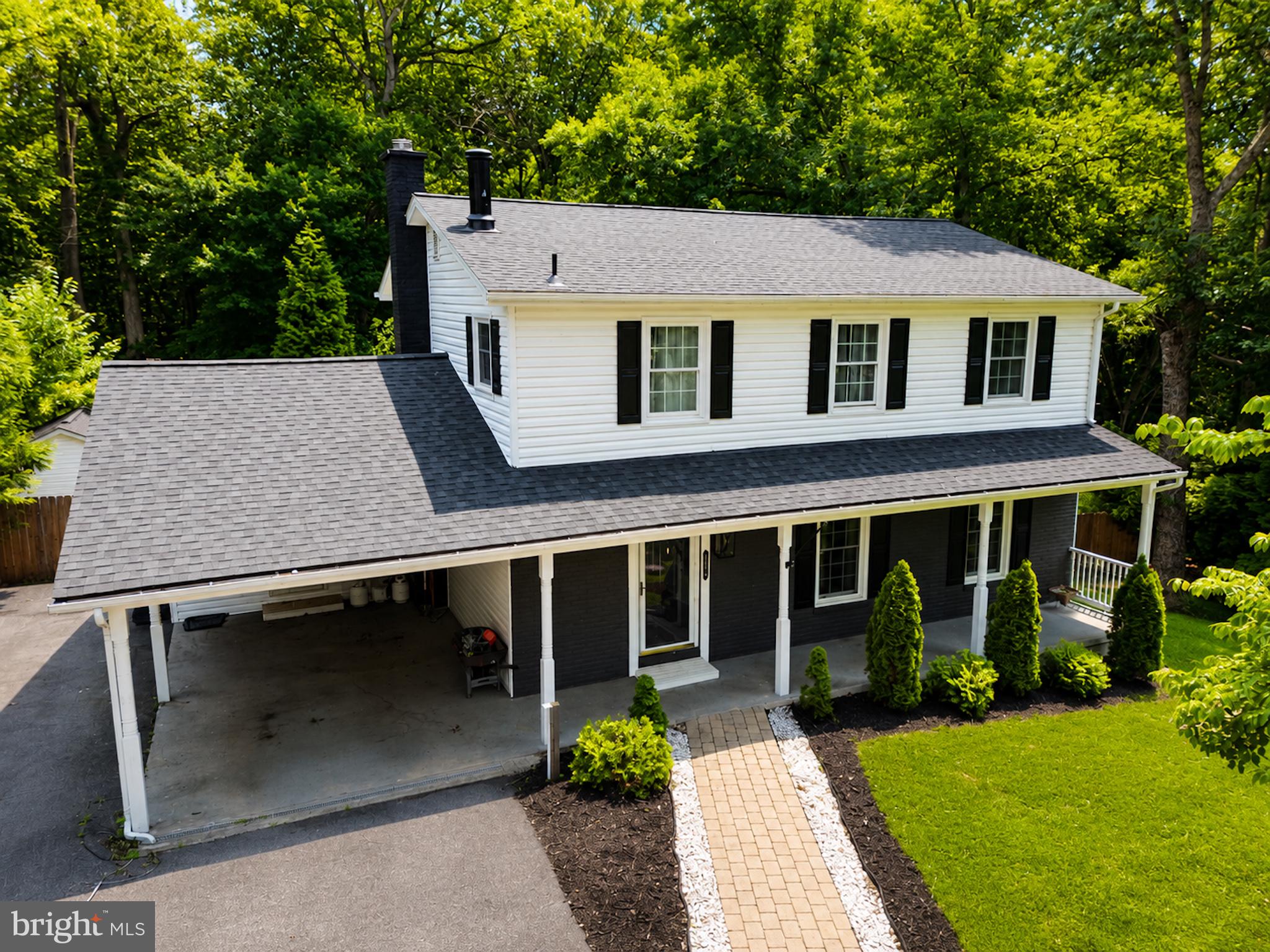 Privacy and Southern Maryland charm come together on nearly 1.5 acres at the end of a peaceful cul-de-sac. This tree-lined property creates a secluded retreat just 2 miles from the beach and features an impressive ¾-acre privacy-fenced backyard, offering endless space for entertaining, pets, play, and outdoor enjoyment. It is conveniently located with easy access to Washington, DC, Northern Virginia, and Pax River Naval Air Station.

This home checks all the boxes—and then some. Beyond move-in ready, every detail has been updated to reflect today's most desirable design trends while maintaining the warmth and character that make this home truly special. Just unpack your belongings, fire up the grill, invite friends and family over for summer gatherings, and spend your evenings stargazing from your own private backyard.

Inside, you'll find 5 bedrooms, 3.5 bathrooms, and three finished levels designed for comfortable living and effortless entertaining, including a new roof in 2024. The bright, open-concept floor plan welcomes you with stunning wrought-iron staircases, a dedicated home office featuring an in-wall electric fireplace, and a beautifully renovated kitchen complete with stainless steel appliances, a Samsung Family Hub touchscreen refrigerator, a spacious breakfast nook, and gorgeous Carrara quartz countertops. Even the designer laundry room has been thoughtfully upgraded.

Upstairs, you'll discover four generously sized bedrooms and two updated, renovated bathrooms showcasing designer tilework and rainfall shower fixtures. The spacious lower level is an entertainer's dream, featuring a complete wet bar with built-in sink, refrigerator, and wine cooler. Double barn doors lead to a dedicated theater room that currently serves as the fifth bedroom or as a home theater.

The outdoor living spaces are equally impressive. Enjoy Maryland summers from the glass-enclosed screened sunroom—perfect for crab feasts and gatherings—or relax on one of two rear decks overlooking the expansive fenced yard, fire pit, and peaceful surroundings. Additional features include a covered carport with upgraded RV power hookup, two large sheds with electricity that are ideal for workshops, hobbies, or storage, and a new septic tank installed in May 2022.

This is more than a home—it's a lifestyle. Opportunities like this are rare, and 30020 Tomahawk Court is ready to welcome its next owners home.
