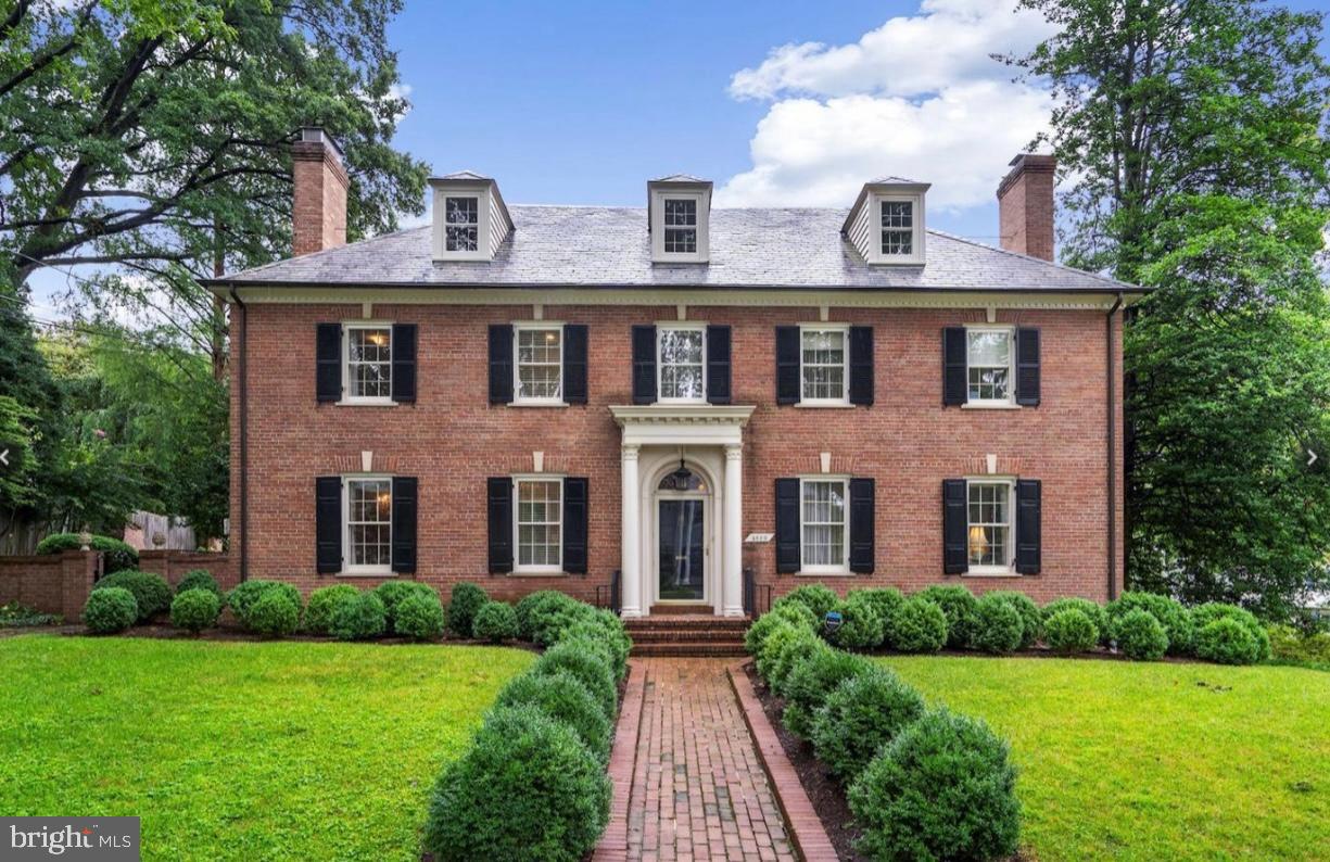 Own a piece of Washington, DC’s architectural history with this impeccably renovated Georgian Colonial, situated on a rare 0.23-acre flat corner lot in the prestigious Kent neighborhood. Originally built in 1946 and recently updated with premium fixtures, this 6-bedroom, 6-bathroom estate spans over 5,000 square feet of luxury living space. The exterior features mature boxwood landscaping and a private, set-back facade that delivers unrivaled curb appeal in the 20016 zip code.

The interior layout is designed for both formal entertaining and modern family life. A gracious foyer leads to a wood-paneled library and a formal living room, both featuring traditional fireplaces. The chef’s kitchen is a focal point of the home, equipped with a Sub-Zero refrigerator, custom cabinetry, and high-end stone countertops. Large windows throughout the main level offer views of the private rear garden and a custom koi pond, creating a seamless indoor-outdoor flow.

The upper levels provide extensive accommodations, including a primary suite that spans the entire width of the home with deep closets and a dual marble vanity ensuite. The third floor acts as a private guest or au pair suite with a full bath. For recreation, the lower level features a large media room with a wet bar, a wood-burning fireplace, and a dedicated home gym. Outside, the flagstone terrace and outdoor fireplace provide an elite space for hosting, located just minutes from Georgetown, Virginia, and Maryland. This premier estate represents a rare opportunity for a turnkey, luxury residence in one of the capital's most sought-after communities.