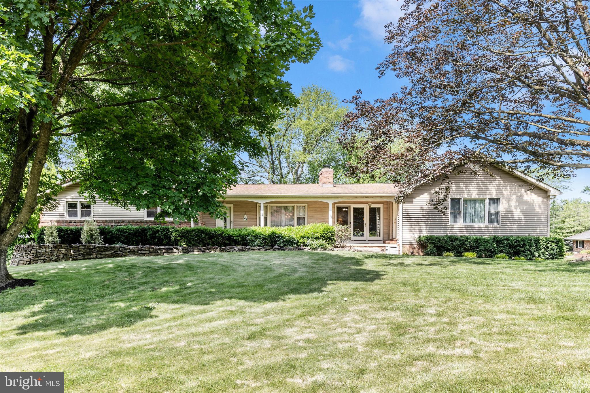 This truly unique property has been extensively remodeled and is one of a kind! It  features 6BR/4BA (including an attached 1BR/1BA inlaw/au pair suite with full kitchen and separate entrance), a 4-5 car garage with high-bay, solar power, and iconic lighthouse replica outbuilding. The house has hardwood floors throughout, crown molding and wainscoting in the living room; granite countertops, maple cabinetry, stainless steel appliances, ceramic tile flooring, and travertine tile backsplashes with motifs and accents in the Tuscan-inspired, remodeled eat-in gourmet kitchen. A spacious fully-finished family/rec room in the walk-out basement leads to an adjoining Trex deck. An en suite bedroom, oversize finished laundry/sewing/crafting room, mudroom, and generous storage space complete the lower level. A 23' x 11' Bonus Room with hardwood floors, crown molding, brick accent wall, and separate entrance on the main level can serve as a formal dining room or a home office. An oversize 24' x 32' attached 2-car garage plus 16' x 40' high-bay built for an automotive lift. Additional 11' x 29' workshop is actually another 1-1/2 car garage that is partially closed off, but can be restored to allow a 5th vehicle to be garaged. The High-Bay and Workshop are heated with propane, enabling year-round usage. Two driveways provide additional paved off-street parking. The detached Greenfield Lighthouse was built in 2015. Its design was inspired by Oregon's Yaquina Bay lighthouse and provides a peaceful retreat, studio, office, homeschooling classroom, playhouse, or more storage space on 2 main levels. A drop-down staircase provides access to a 3rd level, and the 4th level light room provides a view of the neighborhood and beyond.  The entire lighthouse and the inlaw/au pair suite are entirely powered by solar, which also supplies electricity to the remainder of the property. With its separate entrance and full kitchen, the inlaw/au pair suite could be licensed as a Class 3 Auxiliary Dwelling Unit (ADU) (buyer to confirm necessary rules/codes). The solar panels convey and generate an average of 12,000 kWh annually--more than 95% of the property's electrical usage (records available for inspection). Located in the Meadowbrook Estates subdivision, a quiet neighborhood with no thru streets, but convenient access to public transportation, shopping, and I-270.