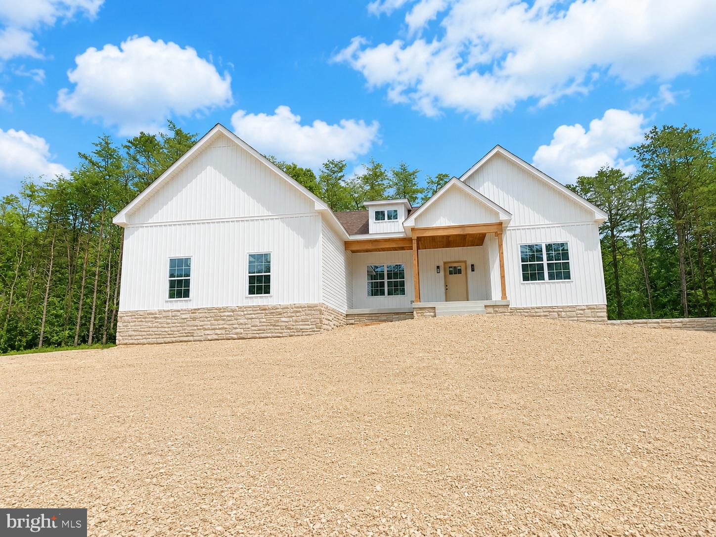 Welcome to your private retreat on over 2 unrestricted acres surrounded by mature trees, offering the perfect blend of peaceful country living and modern convenience just minutes from Berkeley Springs. With no HOA restrictions, you'll have the freedom to enjoy your property your way.
This beautiful new construction home features 3 spacious bedrooms, 2 full bathrooms, and an attached 2-car garage complete with an automatic garage door opener. The open-concept floor plan is designed for comfortable everyday living and effortless entertaining.
The well-appointed kitchen features a large center island, a full stainless steel appliance package, and elegant quartz countertops. Quartz countertops continue throughout the home, complementing the durable and stylish Luxury Vinyl Plank flooring that extends throughout.
Additional upgrades include ceiling fans in every bedroom and the family room, providing year-round comfort and energy efficiency.
The full unfinished basement offers endless possibilities for future expansion, storage, or recreation and includes a bathroom rough-in, making it easy to add additional finished living space to suit your needs.
Step outside to enjoy the privacy and beauty of more than 2 unrestricted wooded acres with endless possibilities for recreation, gardening, or simply relaxing in nature. Spruce Lane and the home's driveway will be paved, enhancing both convenience and curb appeal.
Move-in ready at the beginning of August, this exceptional new construction home combines quality finishes, room to grow, and peaceful country living just minutes from Berkeley Springs.

Additional upgrades include ceiling fans in every bedroom and the family room, providing year-round comfort and energy efficiency.
Step outside to enjoy the privacy and beauty of more than 2 unrestricted wooded acres with endless possibilities for recreation, gardening, or simply relaxing in nature. Spruce Lane and the home's driveway will be paved, enhancing both convenience and curb appeal.
Move-in ready at the beginning of August, this exceptional new construction home offers modern finishes, unrestricted acreage, and a peaceful setting just minutes from the shopping, dining, and outdoor recreation of Berkeley Springs.