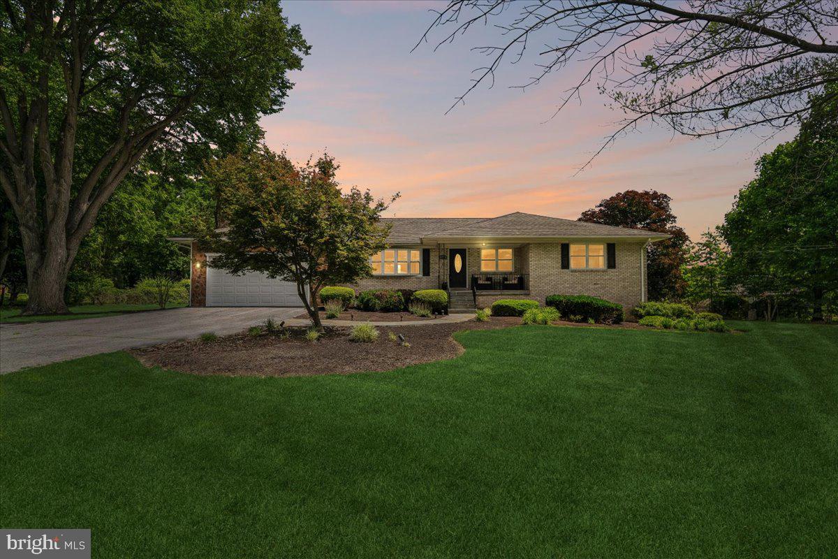Welcome to 1946 — a beautifully remodeled all-brick home that combines timeless construction with modern upgrades throughout. Lovingly maintained and continuously improved by the same owner/contractor since 1980, this property offers exceptional quality, functionality, and pride of ownership rarely found today. Multi generational level living possible , main and lower level bedrooms with full baths. 

Featuring 5 bedrooms and 4 full bathrooms, including 4 bedrooms and 3 full baths on the upper level, plus a lower-level bedroom and additional full bath, this home provides flexible living space for today's lifestyle. A dedicated lower-level fitness room could easily serve as a 6th bedroom, office, or hobby space.

The heart of the home is the updated kitchen, renovated approximately five years ago and complemented by modern appliances, abundant storage, and thoughtful design. Hardwood flooring spans the main level, while the fully finished walkout lower level features durable luxury vinyl plank flooring, a custom granite-topped wet bar, under-counter refrigerator, and ice maker—perfect for entertaining.

Major capital improvements include a high-efficiency 3-zone gas boiler (2024), high-efficiency gas water heater (2024), new Trane high-efficiency central air conditioning system (2025), upgraded 200-amp electrical service, all windows replaced only 5 years ago and numerous additional updates throughout.

Outdoor living is equally impressive with a maintenance-free AZEK and vinyl deck overlooking the spacious, level lot, a slate front walkway, and a walkout basement leading to a large slate patio. Additional features include a wood-burning fireplace with custom built-ins, a two-car garage, and an oversized driveway providing ample parking.

Conveniently located with easy access to the Beltway, ICC, shopping, dining, and commuter routes, this move-in-ready home offers the perfect blend of quality construction, modern efficiency, and exceptional living space.

Don't miss this rare opportunity to own a thoughtfully updated all-brick home in a highly desirable location.
