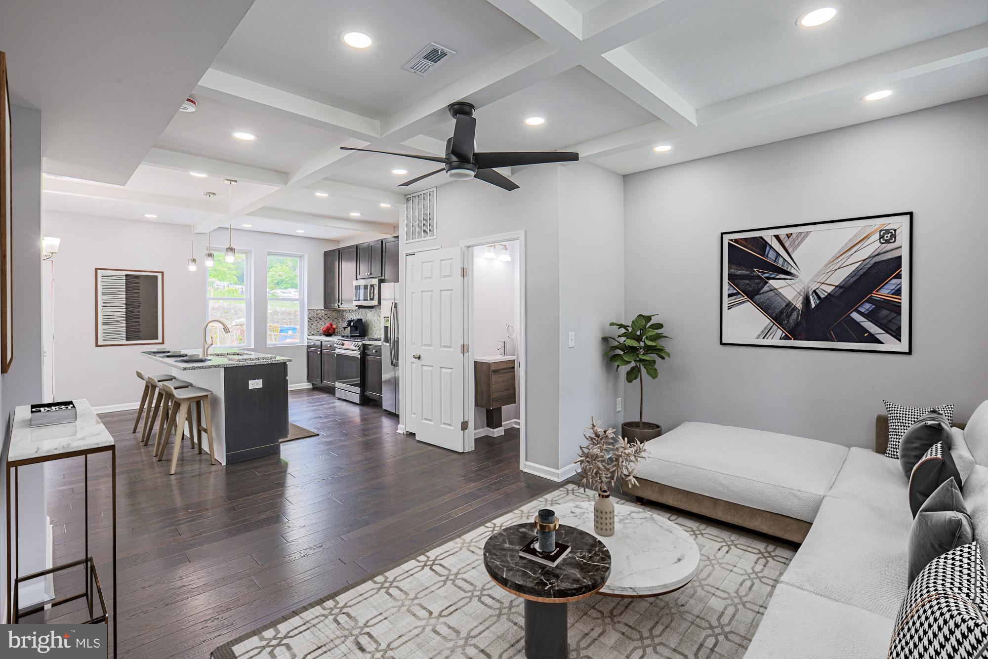 BUYER FINANCING FELL THRU - BACK ON MARKET AT NEW PRICE-  MANY DOWN PAYMENT ASSISTANCE PROGRAMS AVAILABLE. Total renovation - 1730 sq ft where modern open concept lends itself to living and dining that is central to the heart of the home with chef's kitchen.  Features include a beautiful architectural coffered ceiling, formal dining area, separate pantry, functional island with modern cabinets, state of the art stainless steel kitchen appliances including 6 burner Samsung gas smart stove, sleek granite countertops, subway tiled backsplash,  built-in microwave,  Further enhancements include powder room on main level, luxury vinyl plank flooring, recessed/pendant lighting and 2 1/2 new bathrooms.   Completely finished lower level with walk up includes a family/recreation room and large 4th bedroom with dedicated office/study room and laundry.  PERMITS PULLED:  NEW ROOF,  NEW HVAC; WATER HEATER; PLUMBING; ELECTRICAL; WALLS; DOORS.  This quiet street in Pen Lucy is one block from Walter Carver elementary/middle school.  Commuter dream location with easy access to Cold Spring Lane, restaurants, shopping.   NOTE;  THIS IS NOT A DEAD END STREET.  TURN RIGHT AT END OF IVANHOE TO ALLEYWAY THAT GOES BEHIND HOUSES AND LEADS BACK TO MAIN ROAD.