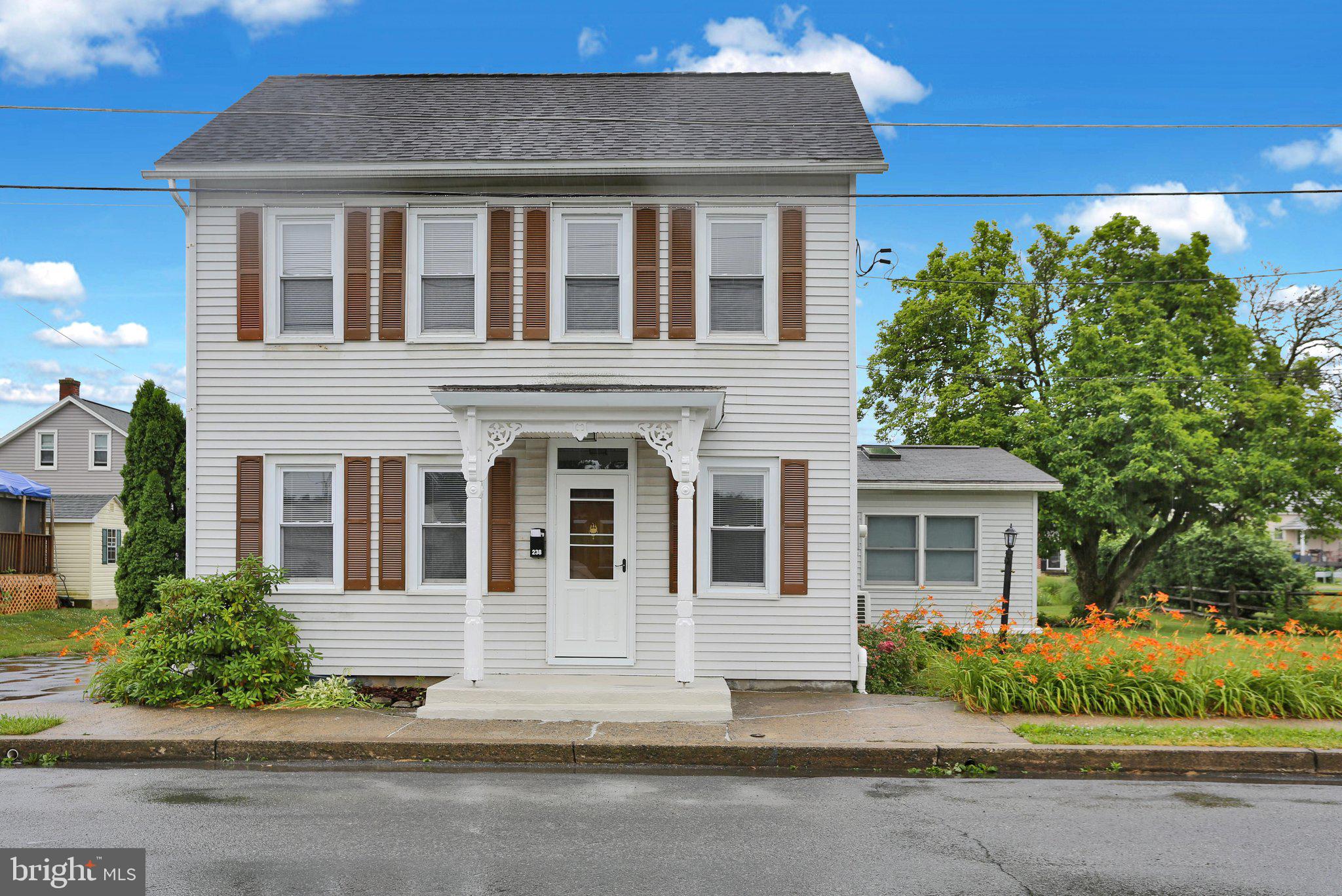 Home was just rehabbed. Three bedroom, two full baths. House was completely repainted, Some newer windows installed, new gas fireplace in Living room, heat pump, mini splits installed for the downstairs,  upstairs has electric baseboard heat.  Large main bedroom with walk-in closet. Open area before you enter the two additional bedrooms, which could be a kids playroom/computer room or Could be an in-home office. Outside is a covered rear porch  with a fenced in inground pool. Koi pond any two car garage. Nice sized rear and side yards.