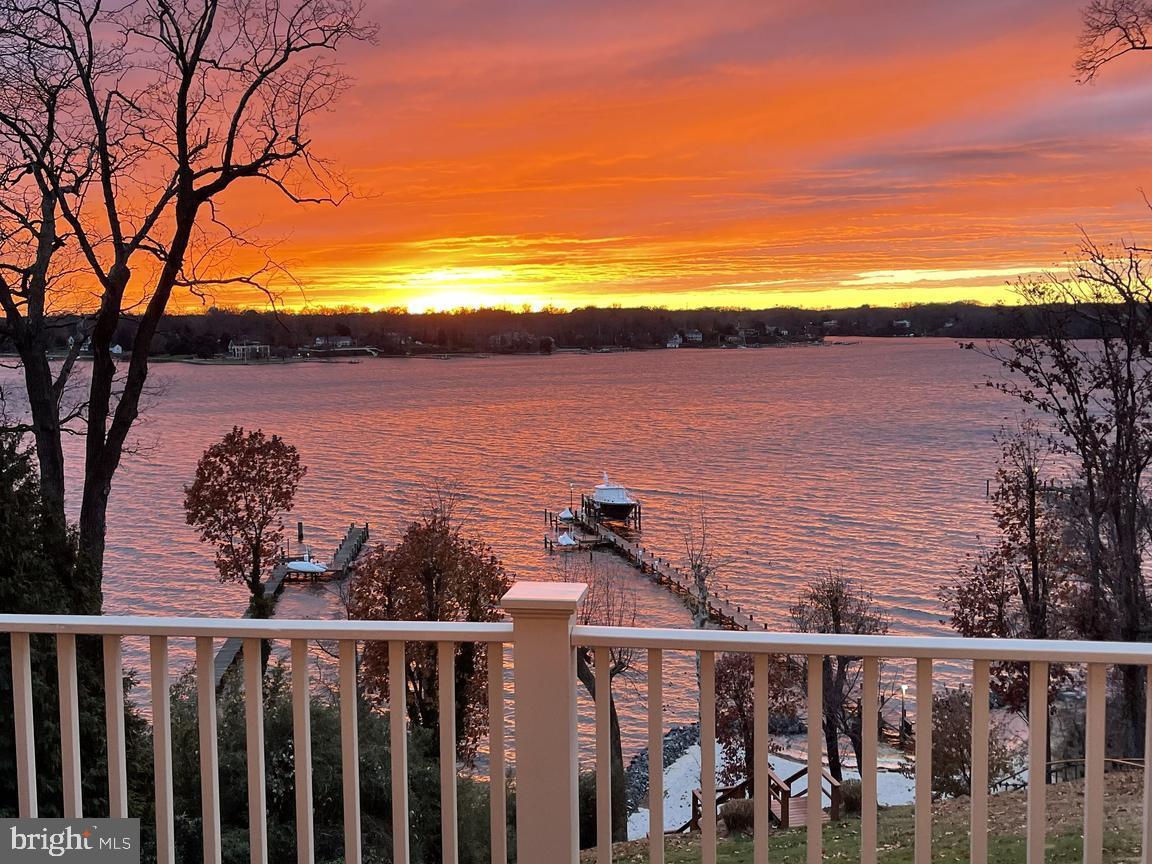 Rare opportunity for a true legacy property on the Severn River! Built by Pilli Custom Homes, this home is a masterpiece of craftsmanship. Wake up every morning to the everchanging scenery out your windows, step out onto your private balcony with a freshly brewed coffee from your in-room coffee bar, feeling the gentle river breeze as you watch sailboats drift by. Make your way down via the elevator or stairs to the heart of the home —a gourmet kitchen designed for both function and beauty. A commercial-grade stove, oversized island, high end appliances and butler’s pantry set the stage for memorable meals, whether it’s a casual breakfast in the sunlit dining area or a feast prepared for guests. The open floor plan ensures that no moment is spent away from the home’s most stunning feature—its endless panoramic water views. Mid-morning calls for a stroll, tram or ATV ride down to your private beach, toes in the sand, as the water laps gently at the shore. Perhaps it’s time for a boat ride. Your commercial-sized pier, equipped with multiple lifts and slips, makes it effortless to set out for an afternoon on the water. The land lovers can take an easy walk into Annapolis or stay closer to home and lounge by the heated saltwater pool, where the sound of the waves blends with the laughter of loved ones.  A distinguished home office showcases exquisite woodwork, built-ins, and a double-sided fireplace; a great place to catch up on some work if you can take your eyes off the mesmerizing views. As the day winds down, retreat to one of the many cozy sitting rooms including the stunning sitting room with walls of windows, a perfect hideaway overlooking the pool and river, ideal for a quiet moment with a book or a glass of wine. In the cooler months, the home's fireplaces—found in the living room, family room, office, and even the primary bath—offer warmth and ambiance. Evening entertainment takes shape in the lower-level London pub bar, where friends gather for a game of billiards or a lively conversation. A family movie night in the spacious den, a midnight swim under the stars. The possibilities are endless in a home designed for both grand entertaining and peaceful retreat. As night falls, retreat to the primary suite, a true sanctuary with a private balcony, a fireplace flickering in the background, and a spa-like bath where a deep soaking tub and towel-warming drawers create the perfect end to a perfect day. At 1900 Carrollton Road, every day feels like a dream—a life immersed in luxury, comfort, and the beauty of the Severn River. This is more than a home; it’s a legacy. Welcome Home!