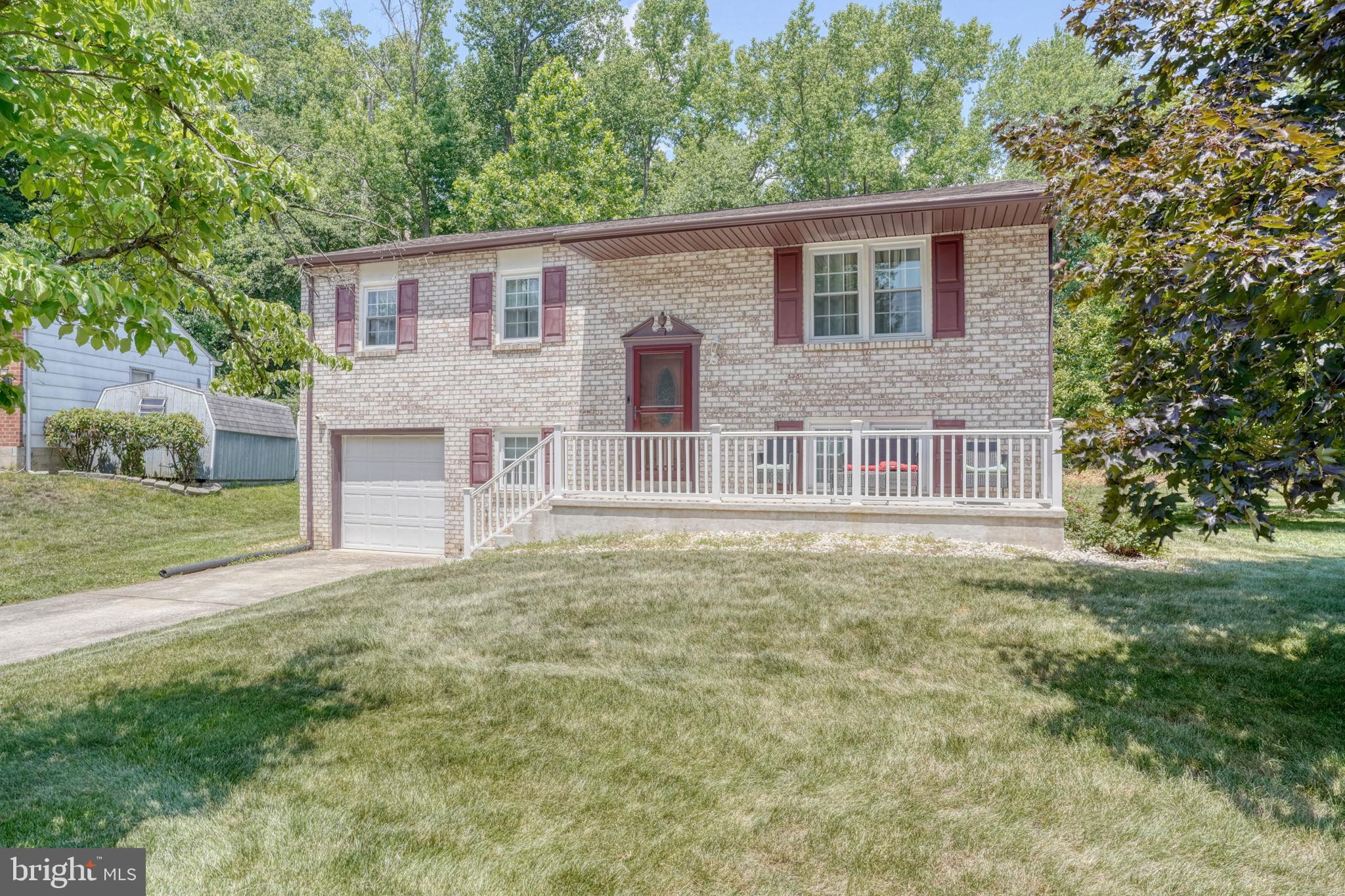 Welcome to this beautifully updated Bi-level home nestled in Glasgow Pines. Situated on a serene cul-de-sac and an appealing corner lot, this home boasts 3 spacious bedrooms and 1.1 updated bathrooms across 2 levels. Upon entering, you will find the entire house adorned with luxury vinyl plank flooring. 
The updated kitchen is quite appealing with granite countertops, a stunning tile backsplash, stainless steel appliances, and ample storage space. The updates continue into the full bathroom, which features a granite countertop and modern tile work. The large lower level, complete with a convenient half-bathroom, presents plenty of space for entertainment or relaxation and seamlessly extending the living space with a walkout to the backyard.  There is an additional finished room that can be used for an office, craft room etc.  The long-time owner has maintained and updated the home throughout the years including; replacement windows, LVP Flooring throughout, Roof (2023), HVAC (2025), Kitchen S/S Appliances (Stove 7/2026), Updated Kitchen and Bathrooms, Custom Stair Railing. 
Outside, the brick front gives the home an inviting and classic curb appeal, while the cozy front porch is perfect for enjoying the peaceful neighborhood. Towards the back, you'll find a covered patio ideal for BBQ, relaxing or entertaining.  A one-car garage offers additional storage options and convenience. 
In addition, a security monitoring system is installed for peace of mind. This home is located close to highways and shopping and is a great opportunity for its new owners.
