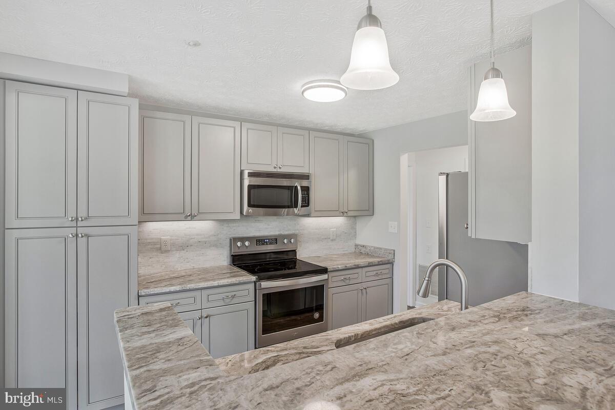 THIS FULLY RENOVATED 2 bedroom 2 full bath home is located in the heart of Piney Orchard walking distance from the community pool, tennis courts, lake , ice rink and shopping center. The fresh tones carried throughout  the home from the kitchen to the bathroom gives you that spa like feel. Your comfort and convenience is already taken care of with the  NEW  HVAC system , WATER HEATER and WINDOWS all installed recently