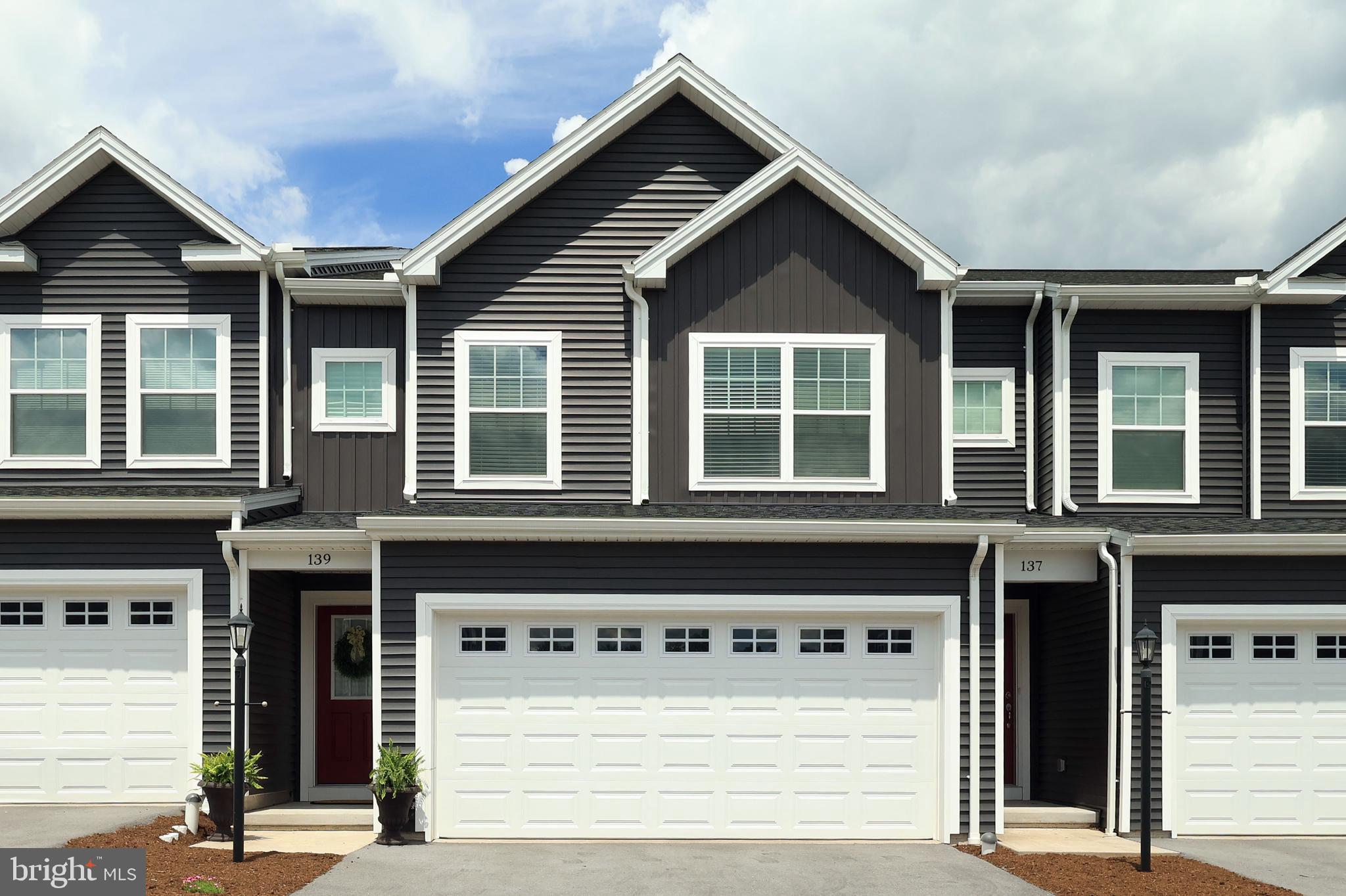 Immaculate, upgraded & truly move in ready this Grays Pointe standout makes settling in effortless. All you need to do is pack & go. Thoughtfully improved & freshly updated, this home now features luxury vinyl plank flooring throughout the entire main level, creating a cohesive, modern look that enhances both style & durability.  Set in the heart of Grays Pointe, this bright & beautifully maintained home offers a freshly painted interior & an intelligent open concept layout designed for easy everyday living. Step inside to an inviting foyer that leads to a convenient half bath & into the refined, well appointed kitchen showcasing crisp white cabinetry, quartz countertops, a pantry, included stainless appliances, recessed lighting, modern pendant lights & an island with storage & a charming breakfast bar.  The kitchen flows seamlessly into the great room, where sliding glass doors open to the rear patio the perfect spot for morning coffee or evening unwinding. Unlike many other available units with limited outdoor space, this home backs to an expansive green area, offering a rare sense of openness & room to breathe.  Upstairs, you’ll find a spacious primary bedroom with a large walk in closet & a private full bath featuring a dual vanity & walk in shower. Two additional bedrooms, another full bath & a convenient laundry room complete the upper level.  The unfinished basement with a 4x4 egress window provides excellent storage or the opportunity for future finished living space. Additional highlights include window treatments, a heat pump, central air conditioning & an attached 2 car garage.  Ideally located just 2 miles from I 99 & minutes from medical offices, shopping, local restaurants & only 11 miles from Beaver Stadium, this home blends comfort, convenience & low maintenance living in one exceptional package. A rare find in Grays Pointe polished, updated & ready to welcome you home.