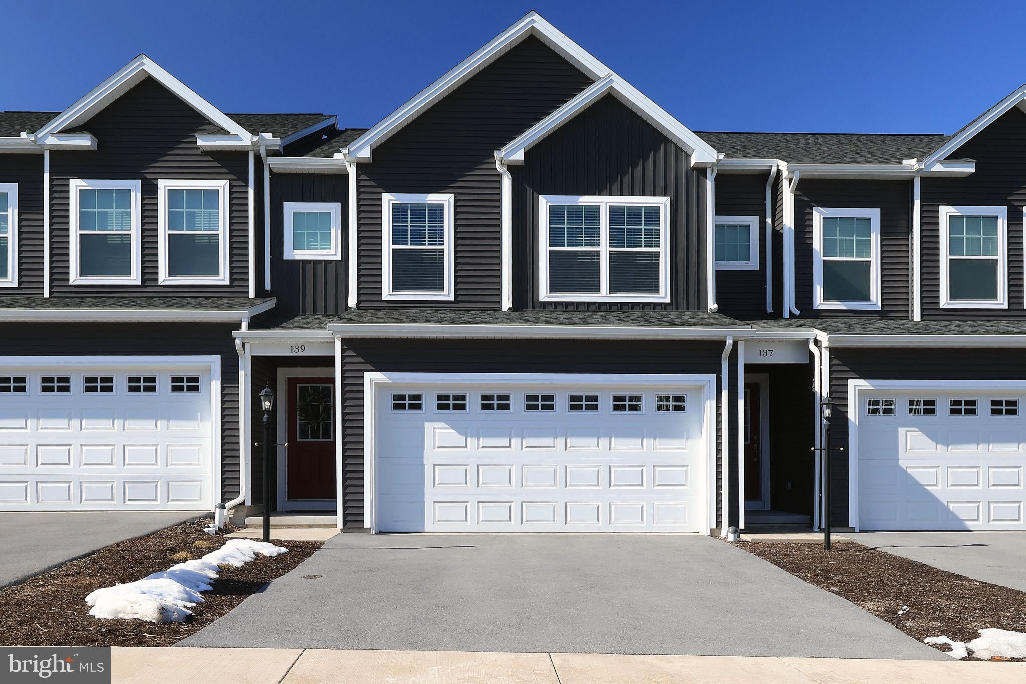 Immaculate, upgraded & truly move‑in ready — this Grays Pointe gem makes settling in effortless. All you need to do is pack & go.  This shining star in the heart of Grays Pointe offers a freshly painted interior & an intelligent open‑concept design ideal for easy everyday living.  Step inside to an inviting foyer that leads to a handy half bath & then into the refined, thoughtfully appointed kitchen featuring upgraded crisp white cabinetry, quartz countertops, a pantry, included stainless appliances, recessed lighting, sleek modern pendant lights & an island with storage & a delightful breakfast bar. The kitchen flows seamlessly into the great room, where sliding glass doors open to the rear patio, perfect for morning coffee or evening unwinding.  Upstairs, discover a spacious primary bedroom with a large walk‑in closet & a private full bath with a dual vanity & walk‑in shower. Two additional bedrooms, another full bath & a convenient laundry room complete the upper level.  The unfinished basement with a 4x4 egress window provides excellent storage or the opportunity for future finished living space. Additional highlights include window treatments, heat pump, central air conditioning & an attached 2‑car garage.  Ideally located just 2 miles from I‑99 & minutes from medical offices, shopping, local restaurants & only 11 miles from Beaver Stadium, this home blends comfort, convenience & low‑maintenance living in one exceptional package.  A rare find in Grays Pointe polished, prepared & ready to welcome you home.