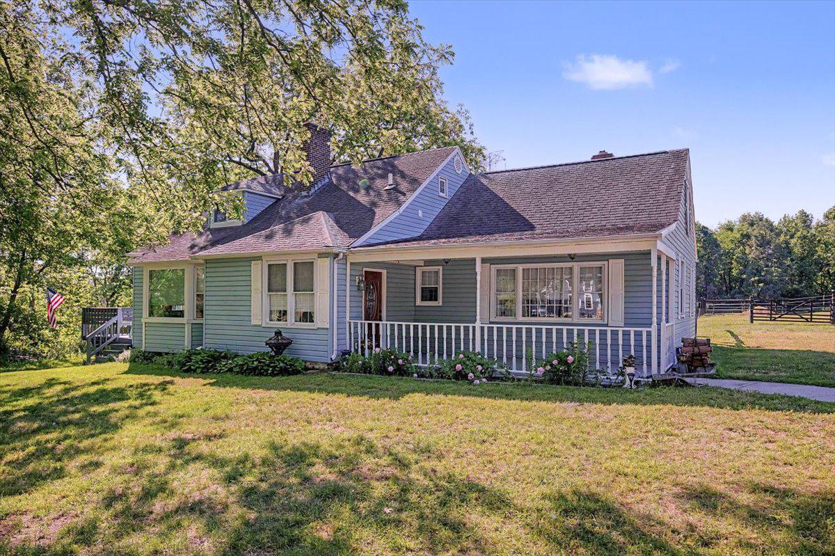 Welcome to 1010 Red Lion Road where your country dreams can begin! This three-bedroom, 2-full bath cape features a first floor bedroom and full bath, with a gracious country layout:  huge kitchen with all new appliances, new LVP flooring (and in the 1st floor bathroom), new Anderson renewal window over the kitchen sink with transferrable warranty, and a dining area featuring bay windows that draw in natural light, an island, a laundry nook in the kitchen, plus the whole kitchen affords a view of the over 2-acre lot; a huge family room at the back of the house that has a wood burning fireplace with a custom mantle from South Africa, new Anderson windows on the side of the family room; new carpeting on the first floor; a generously-sized living room with another wood-burning fireplace at the front of the house; a spacious covered front porch; a large side deck (23'9" x 9'2") that is accessible from the living room and the kitchen; and an awesome back deck (35'11" x 13'4") that is accessible from the kitchen and the family room as well as the basement. Upstairs there are two more large bedrooms, another full bath, a bonus room, and a large walk-in attic that could be finished for more living space or left as it is for great storage space. The basement is unfinished and ready for you to set up your workshop; the seller has even left you some work space to get you started! Venture out to the back of the property where you will see the four pastures with fencing that is wired for electricity and a barn with two 12' x 12' stalls, two run-ins, running water and electric, plus a tack room and hay storage. The barn has a separate electric meter from the house. This is your chance to bring your horses with you (and possibly add some additional furry or feathered friends). This property was originally part of a larger parcel of 15 acres where an orchard once stood. There are still beautiful trees here (love the tulip poplar beside the driveway and the trees that surround the lot) and the land has been separated into four pastures. Inside the house, there is hickory wood panelling which was installed years ago, and new flooring which was installed recently. This house is a wonderful combination of the old meeting the new and allows you to enjoy the country while having easy access to shopping and highways. The sale of the house is contingent upon the Seller's settlement on a new home.