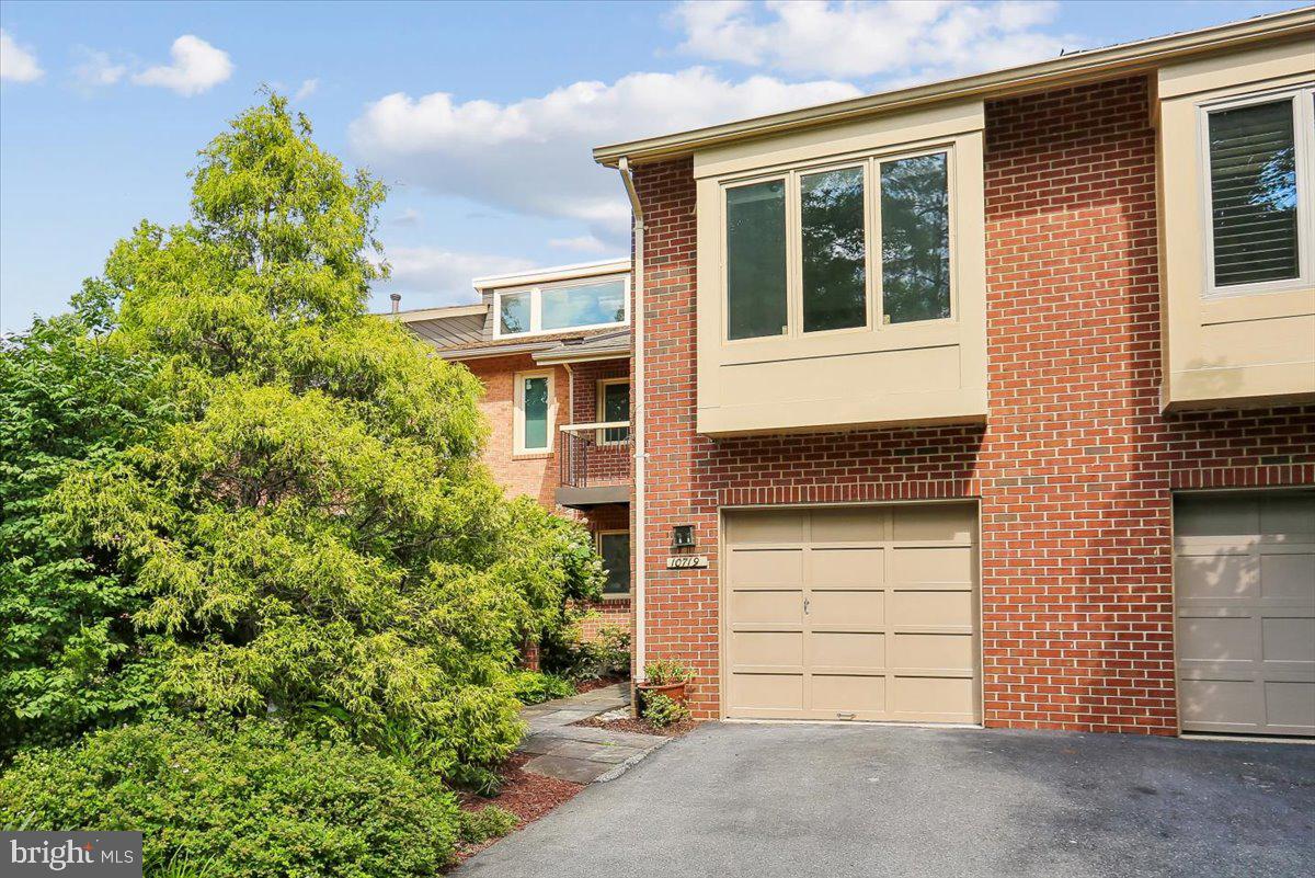 This North Bethesda townhouse could be "it!"  With over 3,200 square feet, this townhouse has been well maintained over the last 38 years by only the second owner, including newer EcoStar Seneca Shake Roof (2016), skylights (2016), new ProVia front door and storm/screen door (2024), replacement composite deck (2014), A/C system and wifi thermostat (2023), newer appliances including dishwasher (2021), wall oven (2018), and clothes washer (2020).   Enter the front door from your private courtyard, or come in to the kitchen from the attached garage.  Once inside, with fresh paint in designer classic Sherwin Williams Alabster throughout, you'll find the open floor plan and tons of natural light in the combined living and dining room, and access to the deck off the dining room.  The eat-in kitchen is well equipped with newer countertops and a great layout.  the upper level, with its dramatic staircase features the enormous primary suite has two full baths, tons of closet space, and its own terrace.    Rounding out this level are two more bedrooms and a hall bath.  On the walkout lower level, you'll find a spacious family room/rec room with the second gas fireplace, a half bath, a storage room, and a cheery laundry room.  Don't miss the bicycle storage rack in the garage for cycling enthusiasts!  All of this, and all North Bethesda has to offer, including access to Metro, major transportation, the Bethesda Trolley Trail, Whole Foods, Pike & Rose, Wildwood Shopping Center, and so much more!