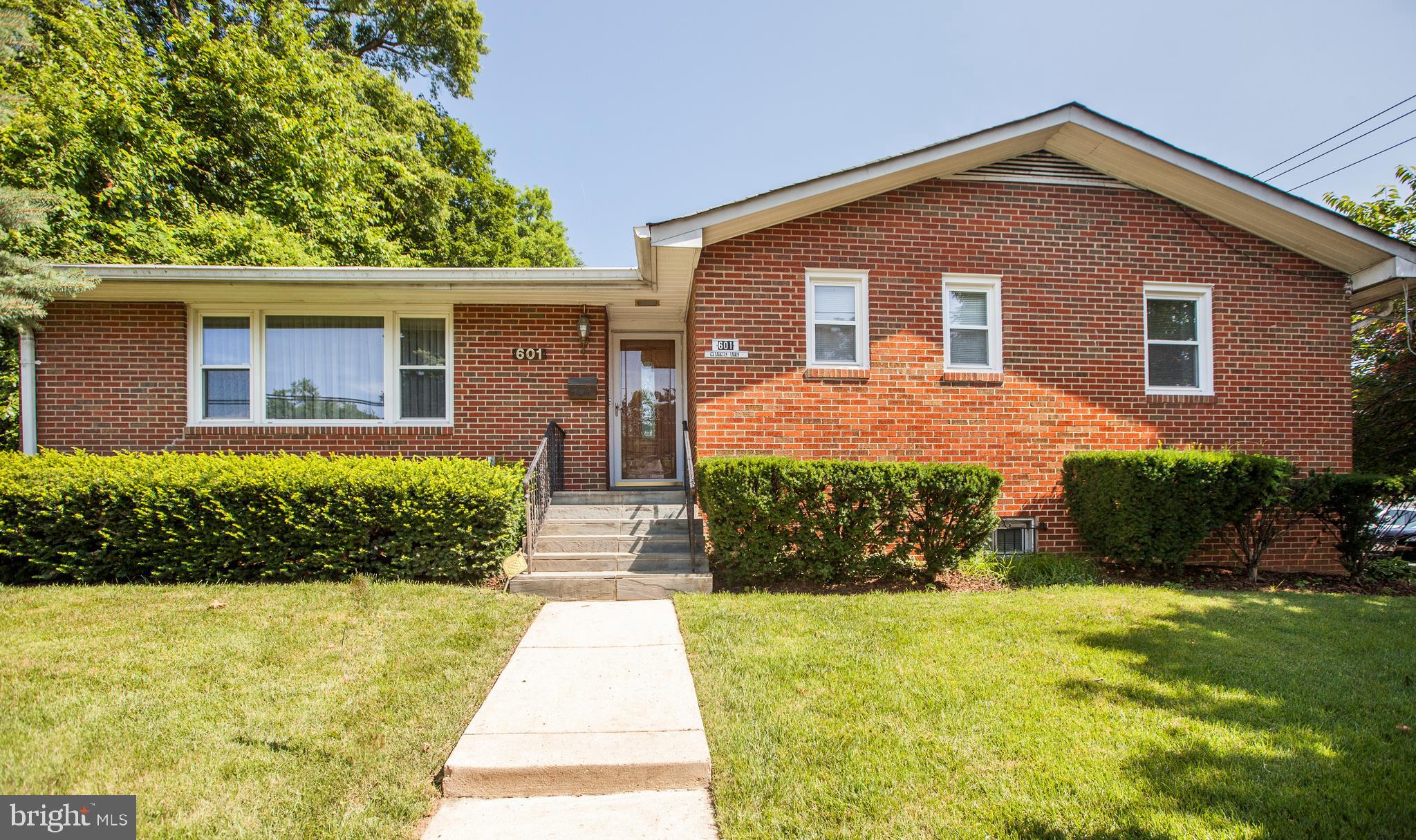 Expanded all brick rambler style home with professional home office and fully finished lower level. Eat in kitchen, family and living rooms. Like new kitchen with granite counter tops and back splash. Gleaming hardwood floors in living and dining areas. Main level laundry room with extra storage. Finished lower level with all new laminated flooring, extra bedrooms and full bath.  Large shed with electricity. Over sized concrete parking. Freshly painted. Walk to downtown shops, restaurants and metro stop.