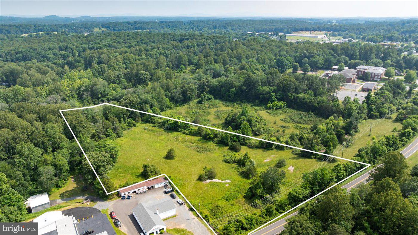 6.3 Acres of Prime B1 Commercial Land in the Town of Madison

Incredible opportunity to own 6.3 acres of commercially zoned land in the heart of Madison County, offered in two parcels—5.8 acres and 0.5 acres. With direct frontage on Main Street and additional secondary access between the Rescue Squad and Madison Plumbing & Electric, this property offers excellent visibility and accessibility for a wide range of commercial uses.

Zoned B1, the property is ideally suited for retail, office, service businesses, or mixed-use development. A sewer line runs through the property, streamlining infrastructure planning for future projects. The land is predominantly level, mostly cleared, and features a picturesque creek adding natural charm and potential design flexibility.

A rare find with this amount of acreage and infrastructure in place —perfect for investors, developers, or business owners ready to grow in a thriving community.