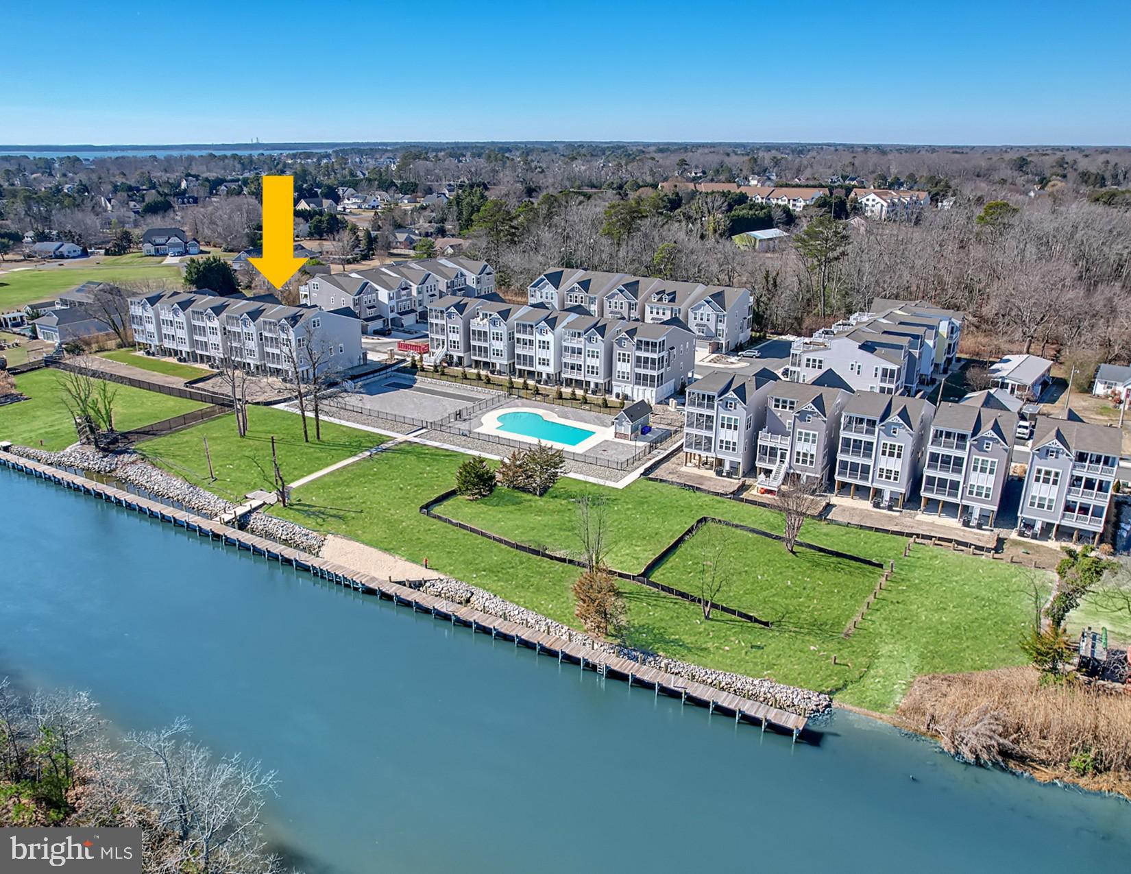 Discover Oyster House Village!   Lot 12 is 100% complete and features 4 levels with 5 Bedrooms and 4 full baths and two 1/2 Baths, three levels of screened porches overlooking the canal, elevator, and lots of other upgrades included in this price (fireplace, outdoor shower, extra windows, elevator, wet bar in loft family room, & more).   Ready to enjoy now or reap the rental rewards - proven rental history of $10K a week in season.  Ideally located on the tranquil waters of the Lewes-Rehoboth Canal in Rehoboth Beach, Oyster House Village consists of 30 luxury single family homes, 13 boat slips, and exceptional community amenities situated on 4.51 acres.   First level features a foyer, three car garage, storage room, elevator, and outdoor shower.   Second level features an owner's suite with private bath and screened porch, three more bedrooms, and two full bathrooms.  Third level features great room, kitchen, dining area with sliders to screened porch, powder room, laundry room, and owner suite with private bath. Fourth floor features a family room and powder room.  Family room leads to screened porch with bird's eye views of the Lewes Rehoboth Canal.  Heated square footage is 3,789 square foot heated (not including screened porches and garages).  There is 1.5 acres of open space in the community.  Amenities include a pool, pool house, and bocce ball court overlooking the canal.   There is a community dock area to sit and relax and enjoy the boats going by, birdwatch, or launch your kayaks and paddleboards into the canal.  There is a public boat ramp next to Oyster House Village to launch your boats or jet skis.  Easy access to downtown Rehoboth Beach attractions without crossing Route One.  Under two miles to the Atlantic Ocean, Rehoboth Boardwalk, shops, restaurants, & beach attractions. Lot 12 offers unobstructed views of the canal. Home is 100% complete and ready to enjoy or reap the rental rewards.