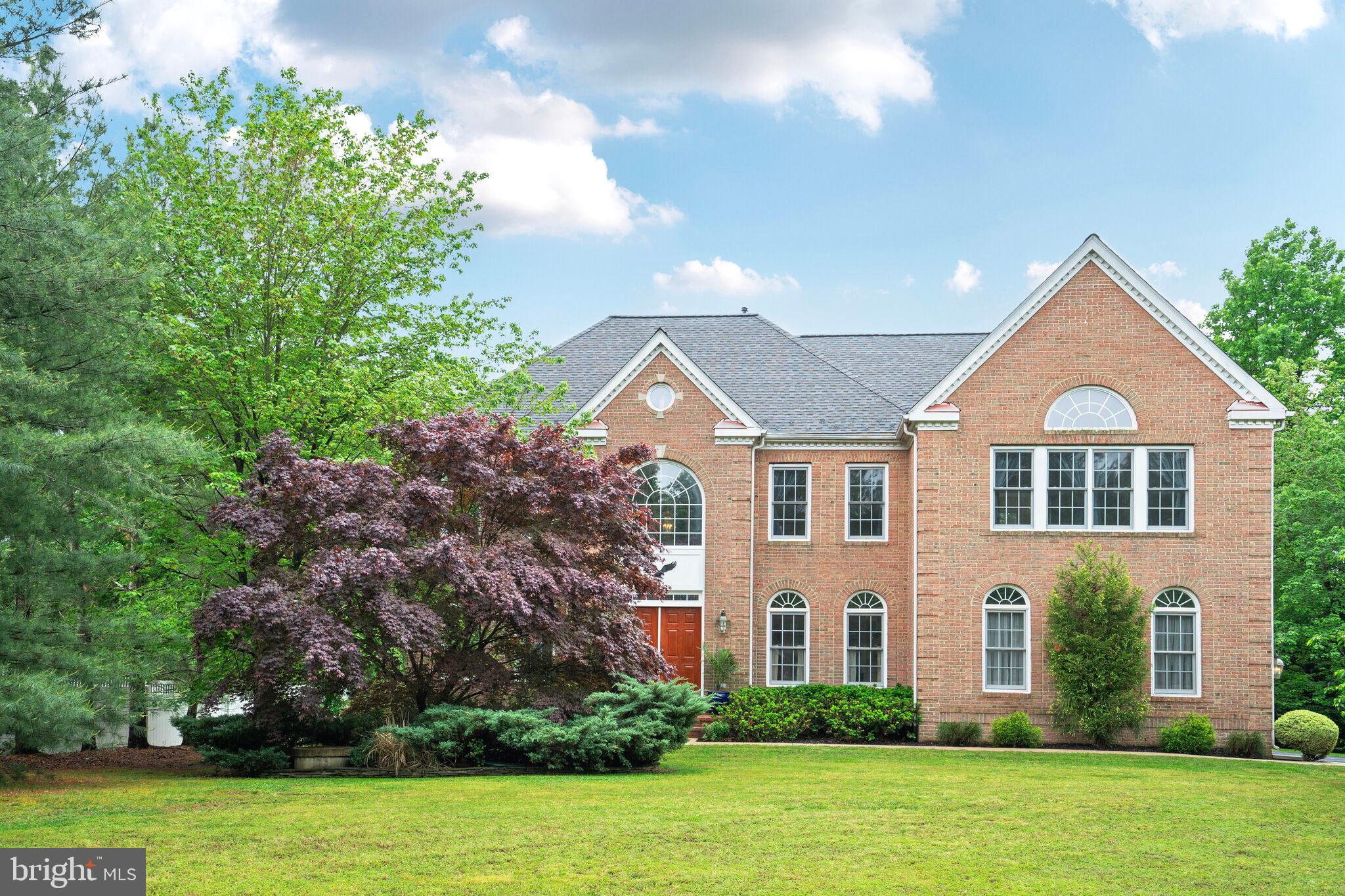 This immaculate Colonial on a spectacular half-acre lot is beautifully appointed and offers over 5,700 square feet of finished, well-thought-out open living space. The house is located in the Belmont Park Estates waterfront community on sought-after Mason Neck, has no HOA, and offers exclusive access to Foster Park on Belmont Bay. This private 7-acre community park has an expansive waterfront picnic area with tables, grills, and a dock with navigable water from Belmont Bay to the Potomac River.

The home features dual staircases, an amazing chef’s gourmet kitchen with a huge walk-in pantry, an enormous family room with a stunning floor-to-ceiling stone hearth fireplace that’s either woodburning or propane gas, an immense primary bedroom with cathedral ceilings, a sitting room, and Juliet window, dual walk-in closets with laundry chute, a luxury salon bathroom with glass shower and jacuzzi tub, a finished walk-up basement with a bright recreation room, fully-equipped wet bar with wine cooler and an ice machine, a media room/home theatre with a beverage center, a game room with dance floor/lighting and billiards, an optional 5th bedroom with full bathroom and jetted tub, two-tier composite deck with hot tub, a cottage-style storage shed with abundant storage space, and a serene, completely private, level backyard. Enjoy nature at its best.

Mason Neck is a sanctuary in Fairfax County famous for its beauty, historical significance, waterfront, and nearby access to I-95, VRE, the Springfield Metro, Mason Neck State Park and Wildlife Refuge, Meadowood Special Recreation Area, Pohick Bay Regional Park, Pohick Bay Golf Course, Gunston Hall (home of George Mason), Fort Belvoir, and Occoquan. The area offers unparalleled walking, biking, boating, fishing, bird watching, horse trails, and much more!