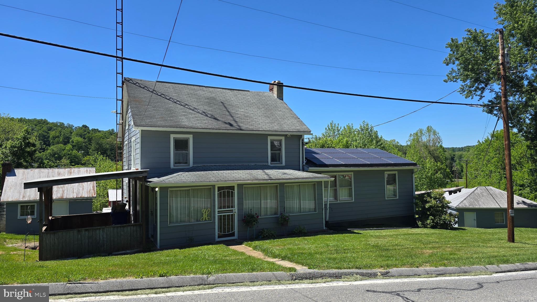 HUNTING, WILDLIFE, FISHING, FARMING PARADISE;  Welcome to Wolfsville!  Rare for a Farmette in Wolfsville to become available so don't hesitate to schedule your tour.   The house consists of 4 bedrooms (1 on main 3 upstairs) a  bright modernized/updated kitchen with NEW appliances and table space.  Beyond the kitchen is the separate room for laundry/pantry/storage.  Dining Room, Family Room,  Main Bedroom and full updated bathroom also main level;  upstairs are 3 bedrooms;  Window A/C units are stored in the attic for the buyer's use.   The basement has a 2nd laundry/washer/dryer and large enough for storage.  Outside is Paradise.....land backs to Middle Creek (if you fish you know how awesome this is) so just walk out back and have some of the best fishing around.   You'll have to get used to seeing all sorts of wildlife crossing the yard, i.e., lots of deer, turkey, fox, bear etc.  All the extra buildings are multi-functional - whatever you need them for.   Truly one of a kind.