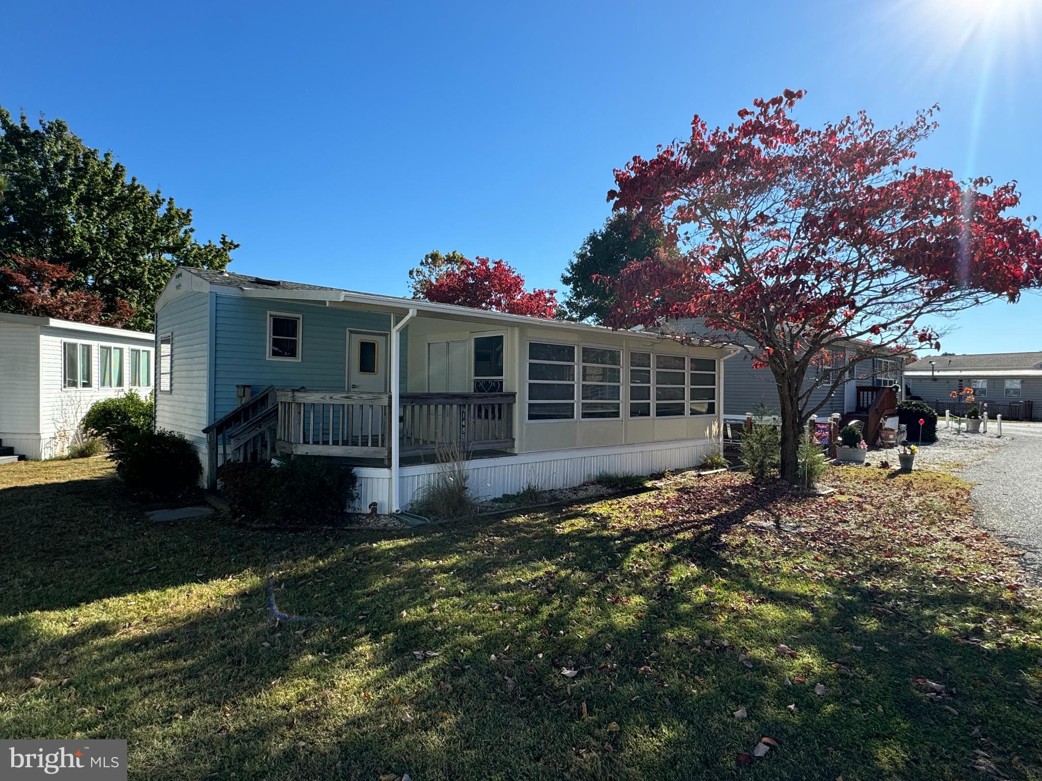 Awesome vacation get-away or second home!  White Horse Park is a fantastic waterfront community that sits off the beaten path, yet just minutes to Ocean City!  Boaters will love the option to have their boat, trailer or kayaks on-site for a small annual fee.  Many other community amenities as well, including on-site management office, marina, outdoor pool, laundry facilities and separate community room.  This home features three bedrooms, one full bath, a fully equipped kitchen with breakfast bar, electric range and full size fridge, new LVP floors throughout.  From the living room, there are sliding doors to a full-width screened porch.  There is a storage shed included.  Sellers will provide boundary survey.  Updates include roof 2014, central A/C 2016, water heater 2018, LVP floors 2024.