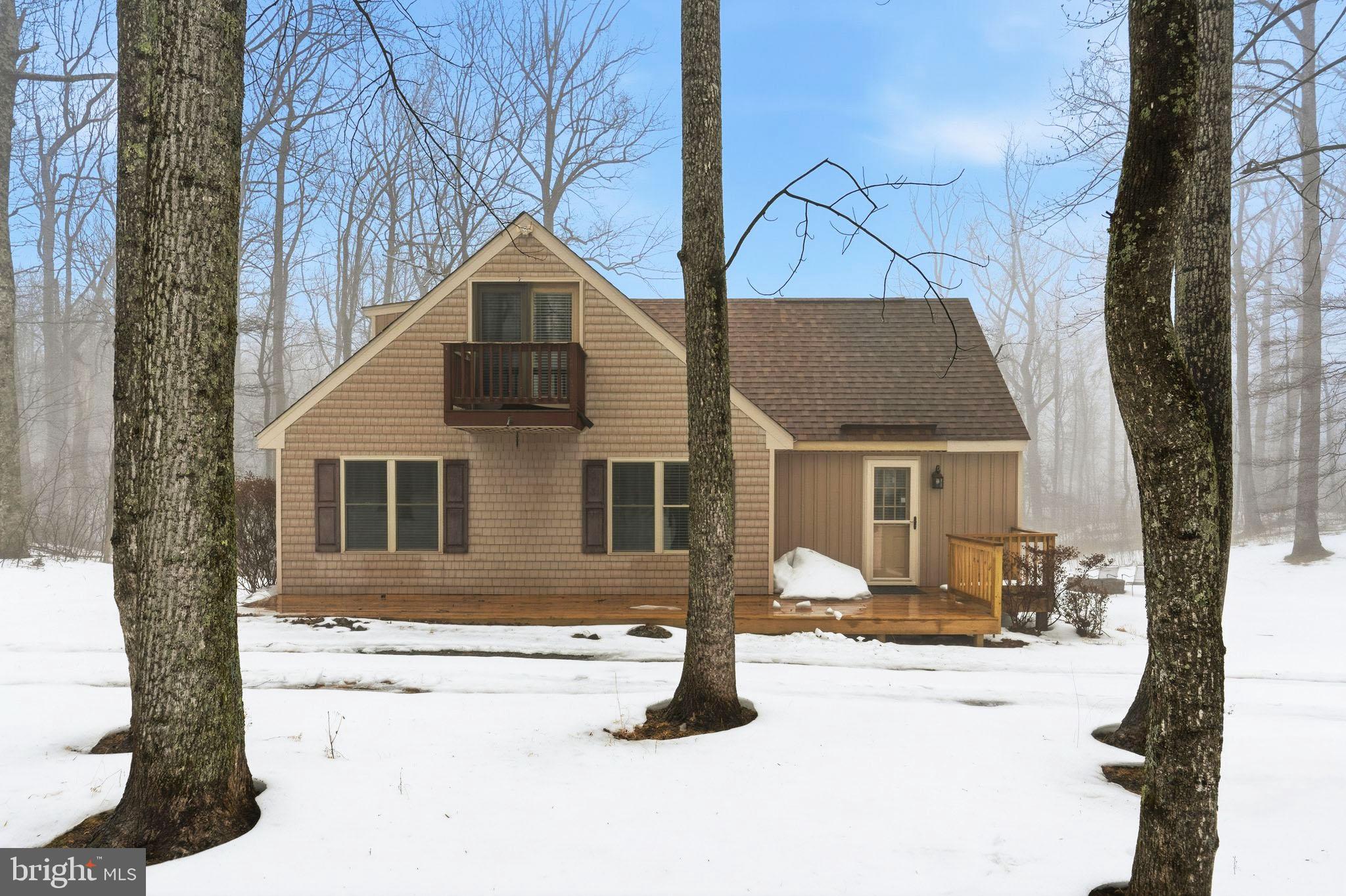 Mountain views, fresh air, and space to make it your own!
Perched on a mountaintop in a private community with very few neighbors, this 3-bedroom, 2-bath home offers the kind of peace and scenery that is hard to find. Surrounded by trees and natural beauty, the setting invites hiking, wildlife watching, and quiet mornings with coffee on the deck.
Inside, the home features soaring ceilings, warm wood accents, and large windows that bring the outdoors in. The open living area flows easily into the kitchen and dining space, creating a comfortable layout for everyday living or weekend gatherings. A lofted upper level adds extra character and flexible space.
There’s a large deck overlooking the woods, an ideal spot for grilling or simply soaking in the mountain air. There is plenty of room for family and visitors alike.
The property has also been operated as an Airbnb, which has excellent potential as a short-term rental, weekend getaway, or income-producing investment.
The property does need some updates, making it a great opportunity for buyers who want to add their own style and build equity in a truly special location. If you’ve been looking for a getaway, full-time home, or investment surrounded by the great outdoors, this mountain retreat is ready for its next chapter.

Some images may reflect virtual staging or digital editing, including removal of personal property, to help showcase the home.