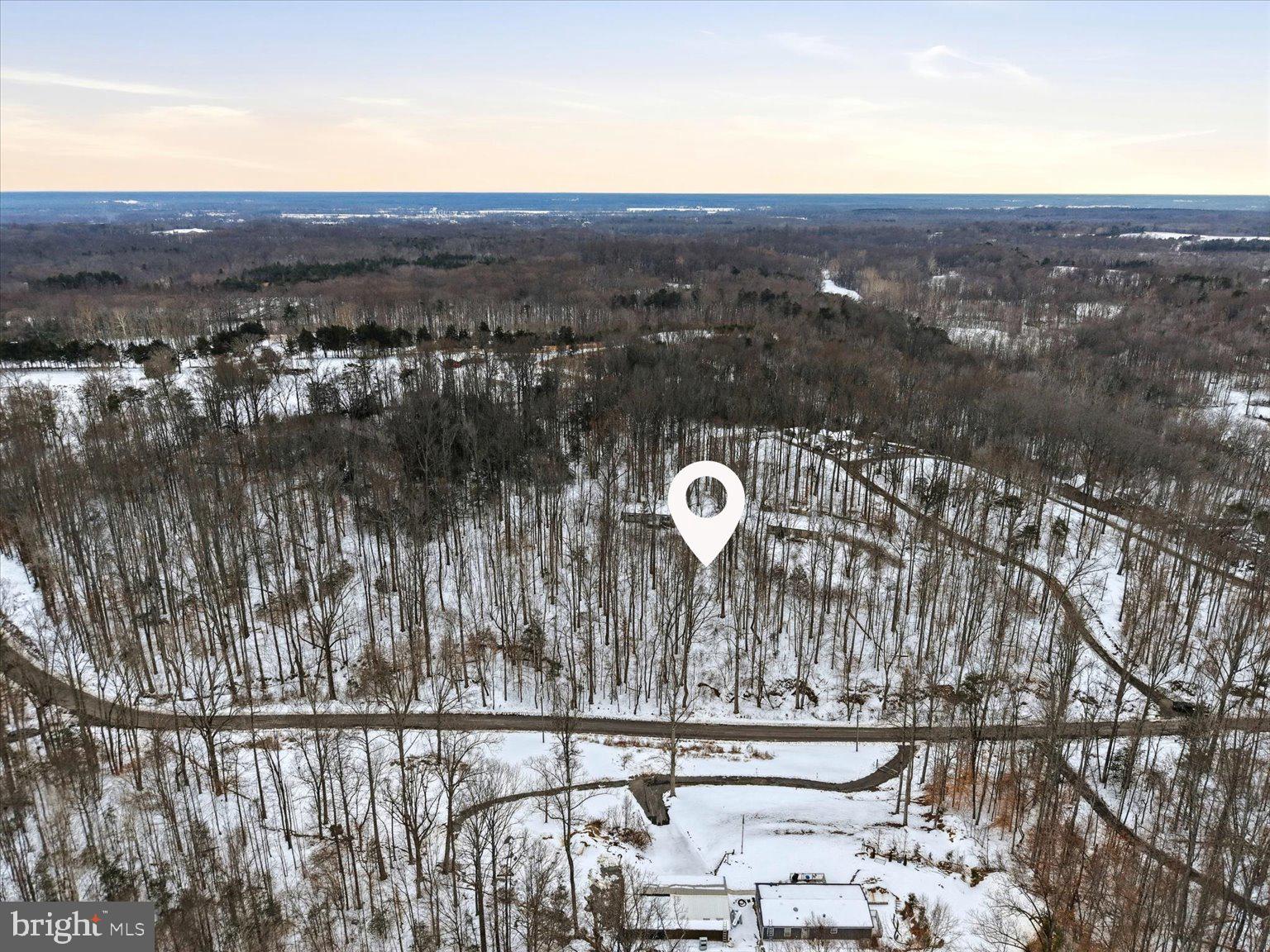 This peaceful residential lot offers a quiet, serene setting, with the gentle sounds of birds and the natural beauty of mature trees. Elevated off the street, the property provides privacy and a tranquil atmosphere. The friendly neighbors further enhance the appeal of this welcoming community.

Located in a growing area with many new homes being built by reputable contractors, this lot is situated in a thriving neighborhood with excellent potential for future development. It is conveniently close to a variety of dining, shopping, and main roads, providing easy access to the King George area.

Ideal opportunity for investors, builders, or buyers seeking a renovation project. Value reflects current condition and future potential. This property is being sold as a tear-down and is an investor special being sold as-is, presenting a great opportunity for those looking to capitalize on the potential of this growing area. Whether you're looking to build or invest, this property offers an excellent chance to create something special in a quiet, accessible location, surrounded by natural beauty and a thriving community.

Seller would like to sell this parcel along with an additional neighboring parcel (MLS#  VAKG2007574) as a package deal. Together, the two parcels total 4.5 acres in King George. This is an amazing opportunity for those seeking more space and potential for development.