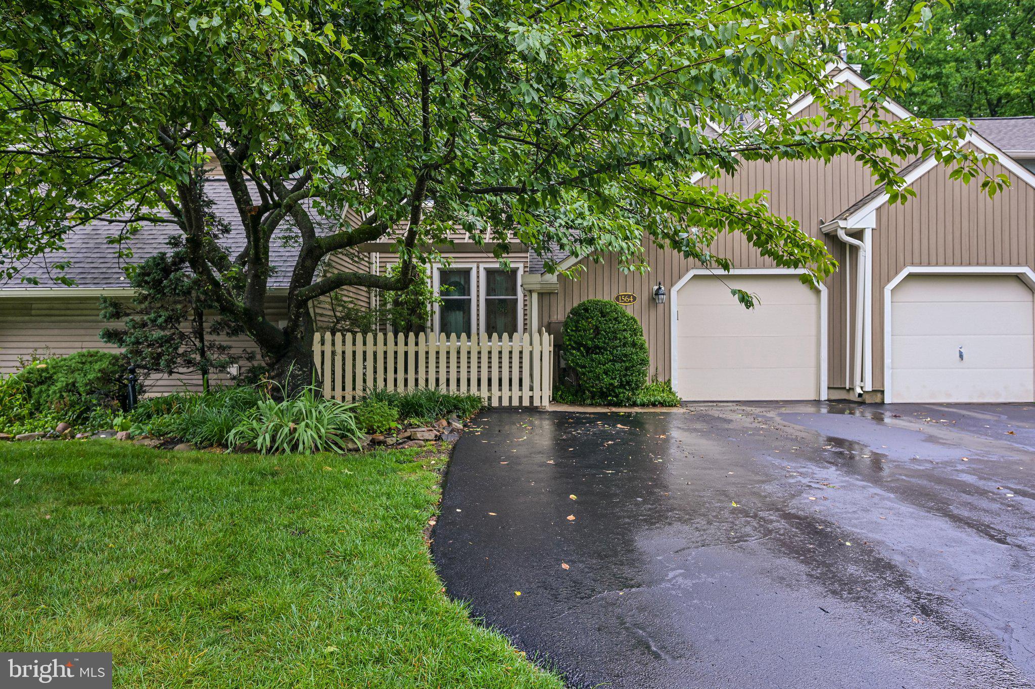 Welcome home to 1564 Applewood, a home that Backs to Nature and has space to grow!  This beautifully updated property is where thoughtful improvements, quality craftsmanship, and peaceful outdoor living come together. From the moment you arrive, you'll appreciate the charming front patio featuring newer pavers, a newly replaced fence and gate (2023), and a waterproofed foundation completed during the patio renovation.
Inside, the remodeled kitchen (2023) serves as the heart of the home, offering granite countertops, a center island with pull-out trash and recycling, and a full suite of updated appliances including a gas range (2026), smart refrigerator with filtered water and ice maker (2024), microwave (2025), and dishwasher. Just beyond, the inviting family room features beautiful hardwood flooring, custom built-in bookshelves, a handcrafted shiplap accent wall, and a newly tiled fireplace with a gas insert (2023), creating the perfect space to relax or entertain.
As you enter, you'll love the custom-built mudroom/foyer area complete with cubbies, coat hooks, and organized storage for everyday living. LVP hardwood flooring extends through the family room and hallway, while durable vinyl flooring flows throughout the kitchen, bedrooms, living room, and dining area.
Upstairs are 3 generously sized bedrooms. The master suite with an en-suite bathroom retreat, and large walk in closet-  as well as a hall guest bath.
The finished walk-out basement offers exceptional flexibility with a full bathroom featuring a shower, generous storage, a utility sink, an additional full-size refrigerator, dimmable lighting, and an existing TV mount—making it an ideal recreation room, home office, guest suite, or potential fourth bedroom.
Energy efficiency and peace of mind are enhanced with several Renewal by Andersen windows and the walk-out sliding glass door, all covered by a transferable lifetime warranty. The laundry room is equipped with a convenient all-in-one ventless electric washer and dryer.
Step outside and enjoy your own private backyard retreat. A stunning oversized second-story Trex deck (2023) overlooks a tranquil wooded backdrop that will remain preserved as neighboring Tanglewood property, providing beautiful year-round views, especially after a fresh snowfall. The fully fenced backyard (2023) also features two fruiting dwarf peach trees and a soon to mature fig tree originally from Shady Brook Farm, adding beauty and seasonal harvests to your outdoor oasis.
Lovingly maintained and extensively updated, this home offers the perfect combination of comfort, modern conveniences, and serene outdoor living. Every improvement has been thoughtfully completed so the next owner can simply move in and enjoy everything this special home has to offer.