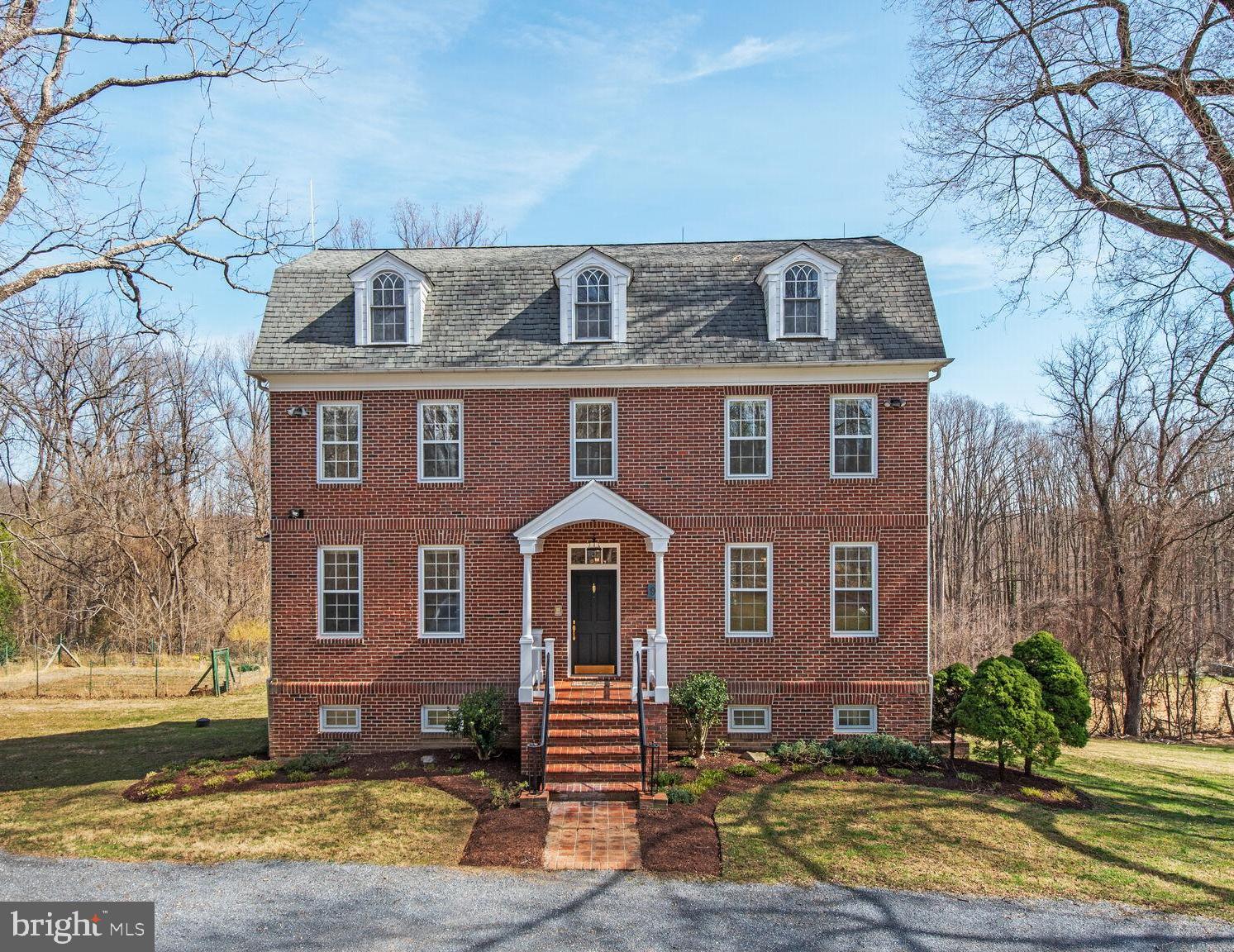 Welcome to your dream home, a stunning all brick custom built, one of a kind Colonial-style residence nestled on a generous 1.53-acre lot, offering a perfect blend of comfort, style, and natural beauty. Built in  late 90's, this well-maintained property boasts 3,360 square feet of finished living space (and an additional 1,450 of space awaiting your finishing touches, featuring four spacious bedrooms and three full bathrooms, making it an ideal sanctuary for relaxation and entertaining. As you step inside, you are greeted by a warm and inviting atmosphere, enhanced by elegant crown moldings, French doors. beautiful wood floors and large windows which let in lots of natural light.  The traditional floor plan seamlessly connects the living areas, including a spacious family room with a cozy wood burning stove off the kitchen, perfect for gatherings. The eat-in kitchen is a chef's delight, equipped with new granite countertops, brand new upgraded stainless steel appliances, and a convenient island, making meal preparation a joy. Enjoy your morning coffee in the breakfast area, or at the kitchen table space, surrounded by natural light streaming through the bay windows. The interior features are designed for modern living, including a central vacuum system, intercom, and recessed lighting throughout. The primary suite offers a luxurious retreat with a walk-in closet and an en-suite bathroom, ensuring privacy and comfort. Additional highlights include a  spacious recreation room on the upper level with access to attic space for extra storage and a sun lit walkout basement with a workshop, providing endless possibilities for customization. The basement has lots of windows and has been framed in and awaits your finishing touches. Step outside to discover your own private oasis in a natural setting. The exterior features a lovely front porch and a deck with stairs leading to the back yard, perfect for outdoor entertaining or simply enjoying the serene views of the landscaped yard, mature trees, an orchard including 10 fruit trees (2 Fig , 4, Paw-Paw, 1 Persimmon, 1 Apple, 1 Cherry, 1 Plum and Black Walnut throughout the orchard) and a gentle creek which backs onto a parkland known as Reddy Branch Stream Park. The property is designed with sustainability in mind, featuring solar panels, geothermal heating and cooling systems, and a fenced vegetable garden, allowing you to embrace a greener lifestyle. Parking is a breeze with a private driveway accommodating up to four vehicles. Security features, including exterior cameras and motion detectors, provide peace of mind. Located in a tranquil setting, this home offers the perfect escape while still being conveniently close to local amenities. The neighborhood is very close knit, and very pet and child friendly.  Don’t miss the opportunity to make this enchanting home your own!