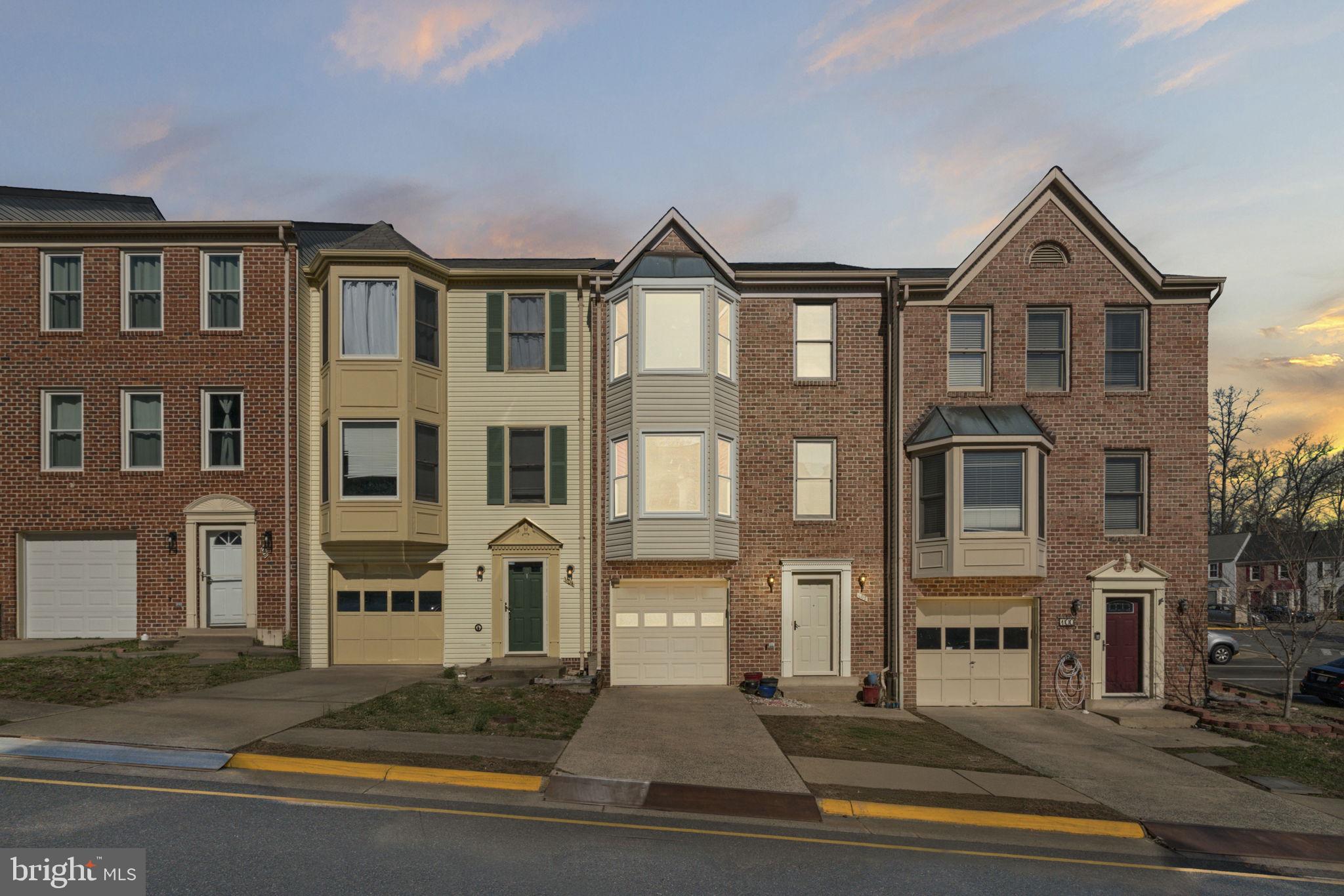 DUE TO INTEREST WE NOW HAVE A DEADLINE FOR TUESDAY AT 10:00 AM. Welcome to this stunning 3-level brick-front townhome, a true gem that blends elegance and comfort in every corner! With 3 spacious bedrooms, 2 full baths, and 2 convenient half baths, this home is designed for modern living. The one-car garage offers easy parking, plus an additional driveway space for added convenience.

Step inside to the beautifully finished lower level, featuring a charming Rec Room with half bath that could easily serve as a guest suite. The main floor boasts a bright and airy living room and at the front of the house, framed by a large bay window that floods the space with natural light. The open kitchen is a chef’s dream, complete with a sleek island, stainless steel appliances (2025 refrigerator, dishwasher, and microwave; 2022 range), and brand new windows in the upgraded sunroom area, which features a bump-out design and skylights for an open, airy feel. The brand-new deck, added in 2025, provides a perfect spot to relax and entertain. This level is further enhanced with gorgeous granite countertops and gleaming hardwood floors.
The main level also features a convenient washer and dryer (2017). 

On the top floor, you'll find three generously-sized bedrooms, including a serene master suite with a Bay Window. The bathrooms feature elegant tiled floors, while new carpet and fresh paint throughout create a pristine, move-in-ready atmosphere.

This home boasts impressive upgrades, including a roof replacement in 2022, recessed lighting in the family and living rooms (2021), and stylish Hunter ceiling fans with remotes in all bedrooms (2021). The kitchen and dining room also feature ceiling fans for added comfort. The low-maintenance vinyl-wrapped double bay windows on the second and third floors add to the home’s curb appeal, while the sunroom blends indoor/outdoor living through its floor to ceiling windows and 4 skylights. 

This home is truly a showstopper—move-in ready and waiting for you to make it your own!
