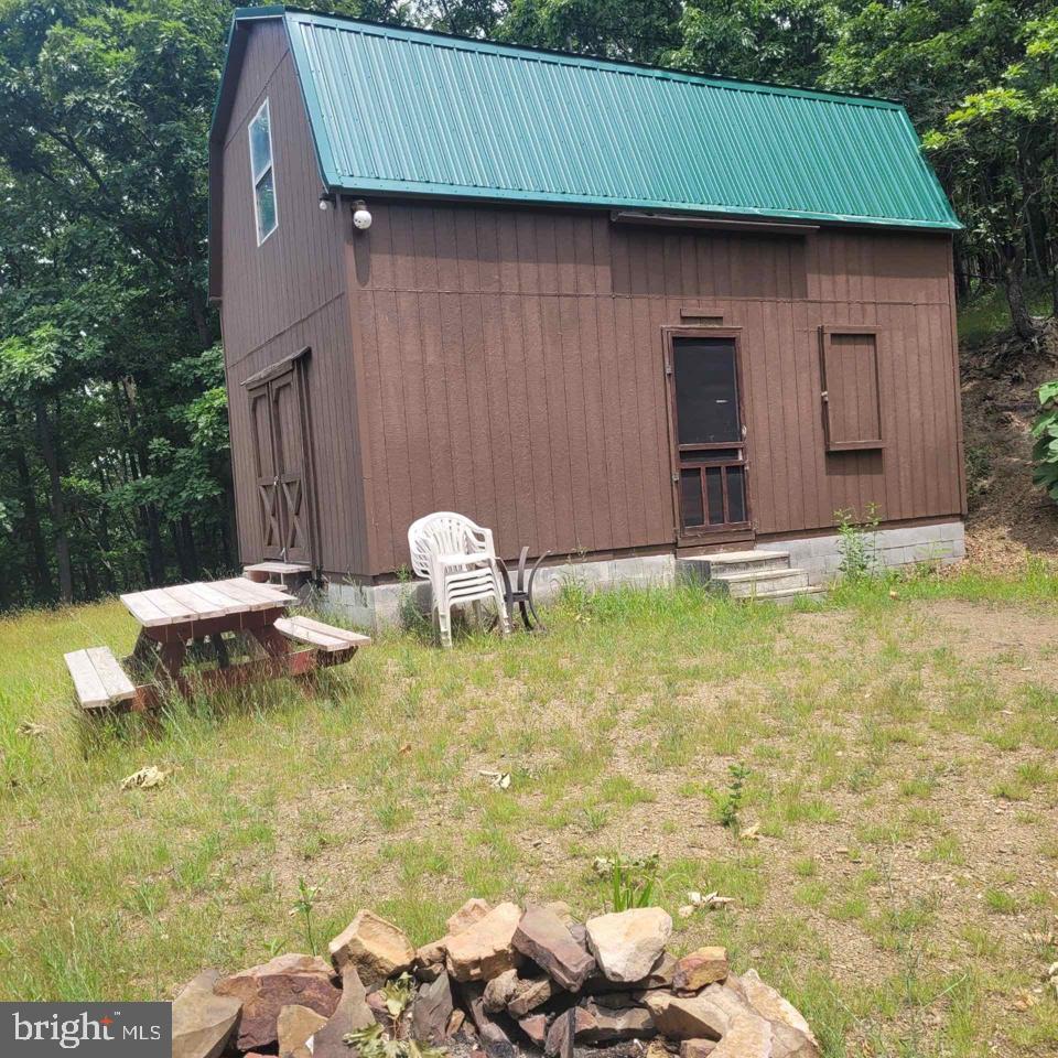 Your little slice of heaven awaits! With over 6 acres and no neighbors on top of you, mountain views is the only thing you'll see. While most of the work is done for you, there's room to add your personal touches.  Whether you're looking for a vacation home, weekend getaway, or personal residence away from the noise, this could be the perfect spot for you.