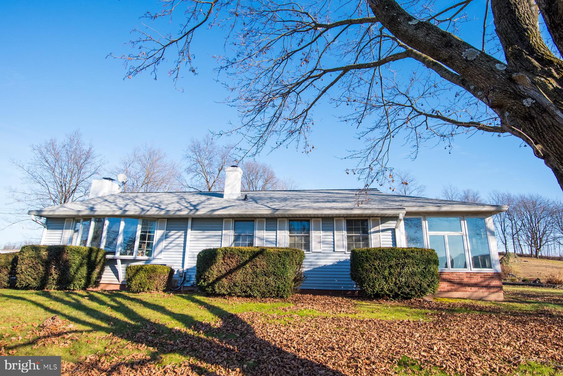 Owen J Roberts School District! 
One owner, custom built, 3 bedroom 2 full bath rancher on almost 1 acre surrounded by farm land that has not been built on since the home was constructed to ensure your privacy! 
 As you make your way up the driveway, you will love the sight of ample parking and an oversized 2 car garage with a 2nd floor workshop. The workshop has a bathroom, office, and is plumbed to add a shower for a possible living space! Owner custom built a pad for a 36 foot camper which can also be used for parking. Driveway has been recently sealed. 
If you love sunlight, this home provides wonderful lighting! The master bedroom has it’s own thermostat, a full bath with heated floors, as well as an attached heated sunroom that can provide access to the 2nd bedroom. The main bathroom and master bath have both been updated in 2021. The fireplace and dryer are both propane. This home also provides a work space and much storage in the basement which is also equipped with a french drain! Many upgrades and great care taken with this home! Such as:
 Brand New 50yr Roof-2023
Central A/C & ductwork-2023
New gutters, downspouts & gutter guards-2019
Bathrooms renovated-2021(master bath has heated floors)
10 kW solar panel system (bill is usually not more then 40-50$) 
Newer Septic System only 10-15 years old