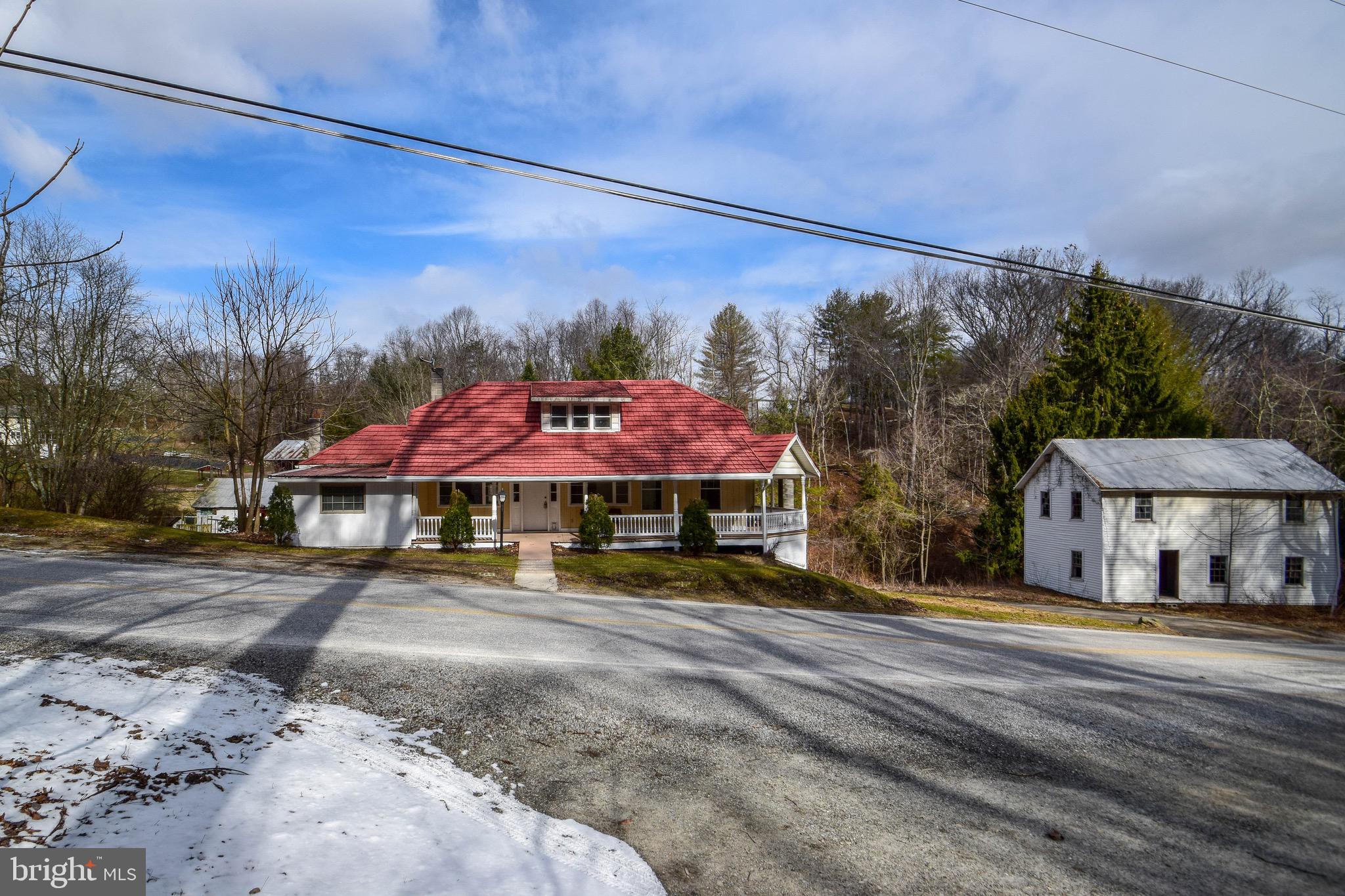 3 Bedroom Cape Cod on 1.5 acres  minutes to Muddy Creek with lots of potential. Boasts open layout and fresh paint throughout with wrap-around porch and full walk-out basement. Nice clear back and side yard offers room to run, and the balance of the property is wooded, offering privacy and a lovely natural setting.  Multiple  outbuildings include 2-story garage/shed and 2-story structure which was the original dwelling on the property. Parking behind house near outbuilding and across road from house. New septic system installed in 2015. As-is condition. Needs work! NO FHA OR OTHER GOVT FINANCING! Sellers motivated, Bring offer!