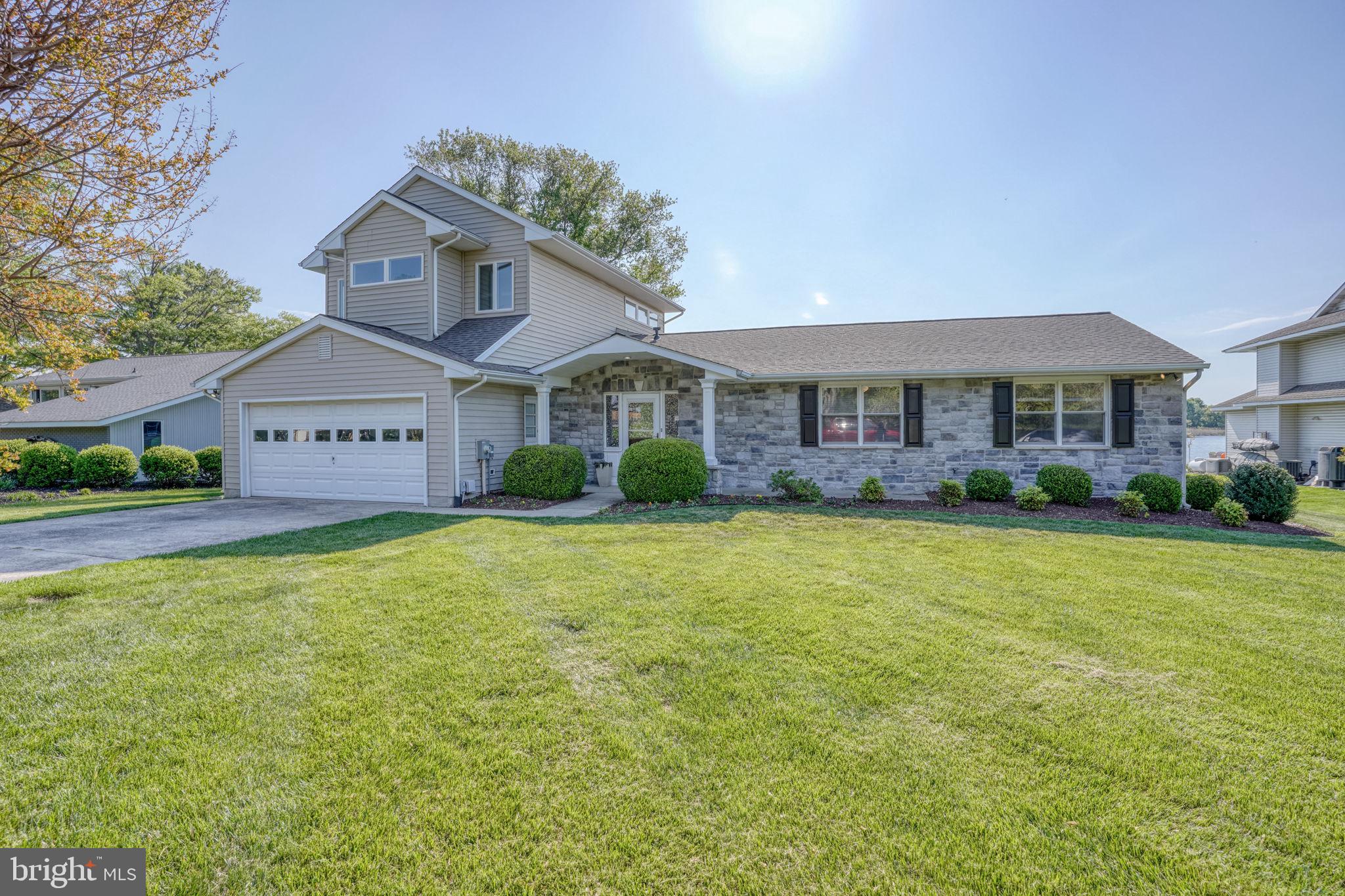 This waterfront home rests on the banks of Price Creek, a protected waterway leading to the Chesapeake Bay. Offering 4 bedrooms and 3 full bathrooms, the home features two spacious primary suites, each with en-suite baths and walk-in closets.

The open-concept floor plan is filled with natural light and showcases stunning water and pool views throughout. Step outside to the screened porch and enjoy gentle breezes and the peaceful sounds of nature. Take advantage of the upgraded saltwater pool, a private boat lift, and the peace of mind provided by a new roof installed in 2024, along with a home generator.

Inside, unwind in comfortable living spaces designed for both relaxation and entertaining, with seamless indoor-outdoor flow that makes the most of this exceptional waterfront setting. Enjoy the protected waters of Price Creek for kayaking, canoeing, or paddleboarding, or venture out to the Chesapeake Bay for a day on the water—all just steps from your back door.

Located in Queen Anne Colony, the community also boasts a marina and playground and the home is just minutes from a public walking trail and golf course.