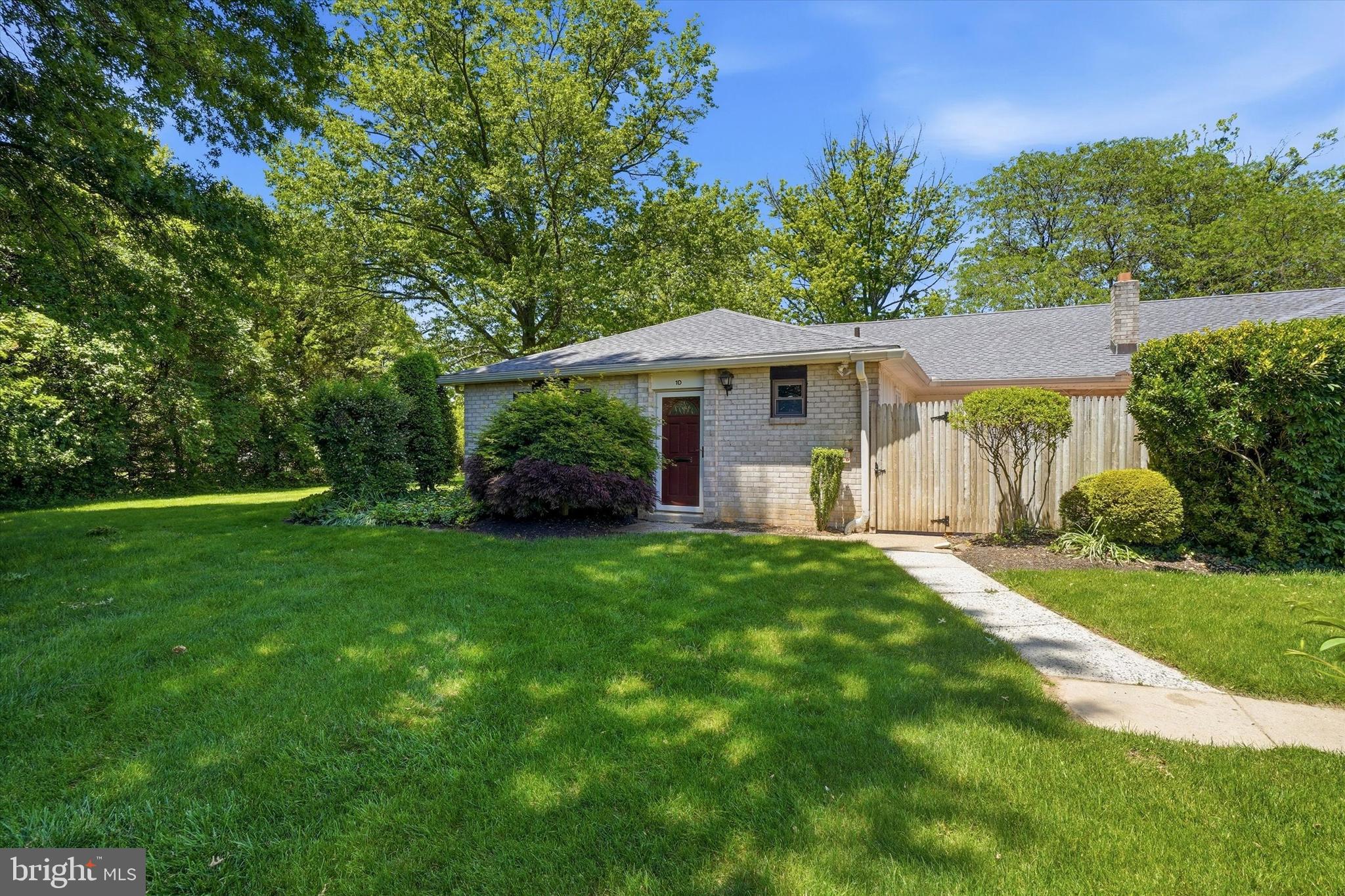 Welcome to this well-maintained 3-bedroom, 2-full-bath ranch-style condo in the desirable Wissahickon School District, offering comfortable one-level living with a thoughtful layout designed for both privacy and convenience. Set back against a peaceful wooded backdrop, this home provides a quiet retreat while remaining low-maintenance and easy to enjoy. The spacious primary suite is privately situated and features an en suite bathroom, a large walk-in closet, and double doors leading directly to the fenced patio—an ideal spot to enjoy your morning coffee or relax outdoors. On the opposite side of the home, two additional bedrooms and a full hall bathroom create separation and flexibility for family, guests, or multi-generational living. At the center of the home, the bright living and dining area is filled with natural light from large doors and windows, creating an inviting space for everyday living and entertaining. The eat-in kitchen offers plenty of storage, including a pantry and additional cabinetry in the laundry room for added convenience. Outside, the private fenced patio extends your living space and creates the perfect setting for summer cookouts or peaceful evenings overlooking the wooded surroundings. Low-maintenance and thoughtfully designed, this home combines comfort, functionality, and easy living.
