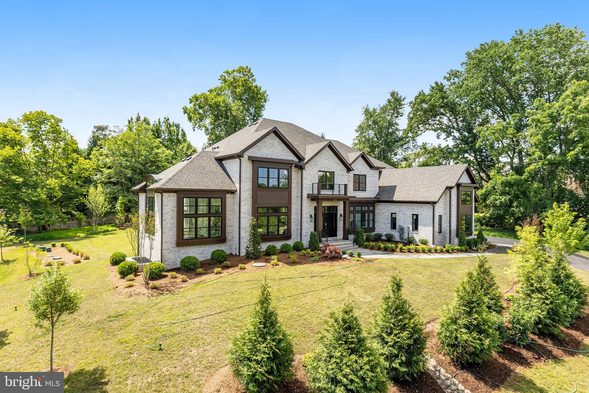 This newly completed Winthrop model offers  contemporary flare,  open concept living and designer interior and exterior features superior to most other new homes in the Langley school district.  4-sides brick offering 6 bedrooms and 6.5 bathrooms with oversized brick and black windows, and large wrap-around deck.  A newly designed "clean contemporary" elevation  gives this home unparalleled street presence.  Expansive professional  kitchen  with large island and oversized walk-in pantry.  Sunlit sunroom and airy conservatory.  The upper level offers 5 en-suite bedrooms and an upper level laundry.  The Lower level is fully finished with a full bar, media and exercise rooms and bedroom.  Conveniently located in close in Vienna, offering an easy drive to Tysons, Reston and surrounding areas.
