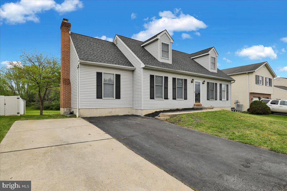 Welcome to 1311 Fredrick Blvd, a beautiful 4-bedroom home located in the desirable Heather Knoll Community within the Muhlenberg Township School District. This spacious home offers a warm and inviting layout with plenty of room to live, relax, and entertain. Step inside to feel the warmth with the bright the front windows that fill the space with natural light. Eat-in kitchen, and sliding glass doors leading to an incredible over-sized deck, and a backyard retreat. The large yard is perfect for outdoor enjoyment. 

Just off the kitchen, the family room with a charming brick wood-burning fireplace with mantle. The main floor  includes two spacious bedrooms and ample closet space, along with a shared full hallway bathroom and linen closet. Upstairs, you will find two additional bedrooms, and walk-in closets. A second full hallway bathroom with linen closet completes the upper level. 

The finished basement adds over 400 square feet of living space and is ideal for entertaining  which includes a convenient half bathroom.
The unfinished basement area with laundry hook-up provides excellent storage and workspace. 

Additional highlights include central air, gas heat, a gas hot water heater, GAF Lifetime shingle roof, and double-wide driveway with parking for four vehicles. With spacious living areas, partially finished basement, backyard oasis, and a fantastic location, this home has so much to offer. Schedule your private showing today, this one will not last!