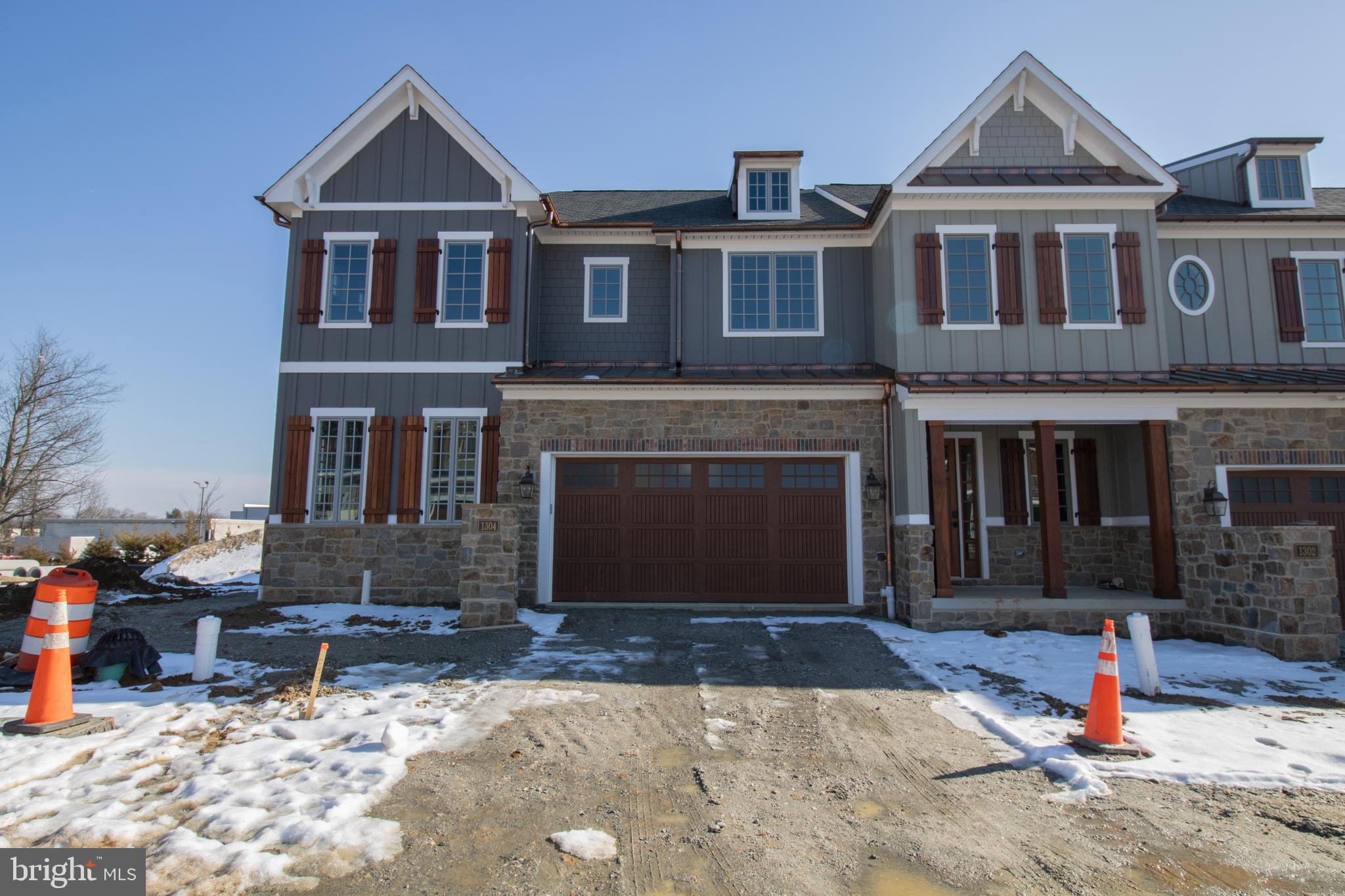 This beautiful end unit townhome is under construction and will be ready for mid-2026 delivery. Spacious owner's bedroom located on the first floor. The covered deck adds a great exterior experience. Exquisite countertops, wood handmade dovetail cabinets, 36" cooktop with double oven and many other finishes complete the gourmet kitchen. This home also features an elevator rough-in, unfinished basement, 10' 1st floor ceilings and many other beautiful touches. Don't wait! Contact sales reps for details. Welcome Home to Active Adult Living at it finest in Columbia Place. The new construction homes feature first level master suite, beautiful green landscaping, exterior details with grand curb appeal. All of this convenient to the best attractions and entertainment in Delaware. The Homeowner Association maintains the common areas of this small exclusive community. Columbia Place features future 24-hour gated access, completed clubhouse with fitness center, walking trails, outdoor common areas and more. Location is just a few hundred feet from Brandywine Creek State Park. Call Sales Center to view. NOTE- Home is currently under construction, photos may be of a similar home