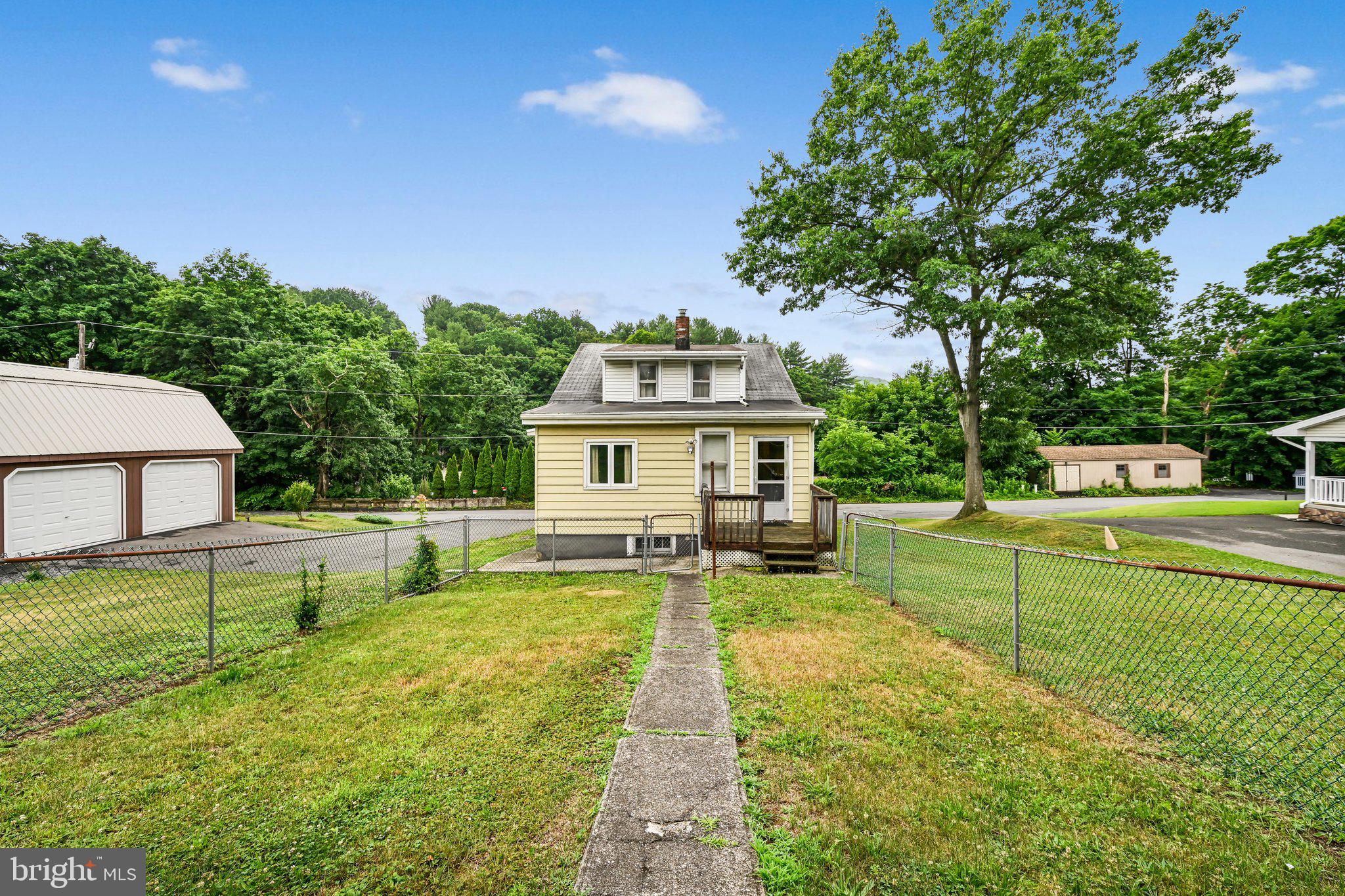 Tucked away off the beaten path in Pottsville's desirable Mechanicsville Borough, this charming and beautifully maintained estate offers the perfect blend of space, character, and opportunity.

Featuring 5 spacious bedrooms, 1 full bathroom, and timeless hardwood floors, this home welcomes you with generously sized rooms and a warm, inviting feel throughout. The thoughtful layout includes two first-floor bedrooms and a full bath, providing flexible living options for guests, a home office, or convenient one-floor living.

Upstairs, you'll find even more spacious bedrooms with plenty of room for a growing family or hobbies. Outside, the impressive 4-car deep garage offers endless possibilities with ample space for vehicles, storage, or the workshop you've always wanted.

Lovingly cared for over the years, this home is move-in ready while offering the perfect opportunity to add your own modern touches at your own pace.

If you've been searching for privacy, character, and exceptional value, this hidden gem is one you won't want to miss.

Show anytime!