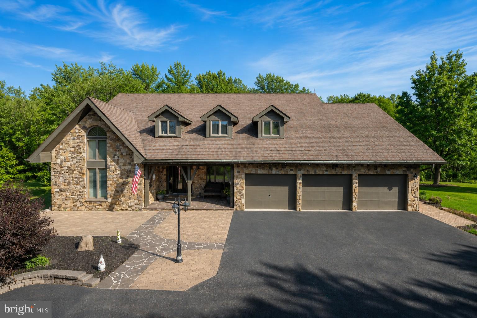 Luxury Living Meets Timeless Country Charm! Perfectly positioned on 10.33 picturesque acres between Oakland and Deep Creek Lake, this exceptional 6-bedroom, 4.5-bath home offers the ideal blend of refined comfort, modern updates, and peaceful privacy.

Step inside to discover an inviting open floor plan highlighted by soaring wood ceilings, a dramatic floor-to-ceiling stone fireplace, and expansive windows that fill the home with natural light while showcasing the serene surroundings. The beautifully updated kitchen is designed for gathering, featuring granite countertops, abundant cabinetry, stainless steel appliances, and a spacious island that flows seamlessly into the dining and living areas.

With six generously sized bedrooms and four-and-a-half baths, there's room for everyone to relax in comfort. Thoughtful upgrades throughout the home provide a fresh, modern feel while maintaining the warmth and character of this impressive property.

Outside, your own private retreat awaits. Spend summer days enjoying the heated in-ground swimming pool, entertain on the expansive rear deck, or simply unwind while taking in the views of the park-like backyard. The sprawling acreage offers plenty of room for recreation, gardening, or simply enjoying the beauty of nature.

Completing the property is a 3-car attached garage, offering ample space for vehicles, outdoor gear, and storage. Conveniently located just minutes from Deep Creek Lake, Wisp Resort, restaurants, shopping, and Oakland's historic downtown, this remarkable home delivers the perfect balance of luxury, convenience, and country living.

Whether you're searching for a full-time residence or a private retreat near Maryland's premier four-season destination, this extraordinary property is one you won't want to miss.