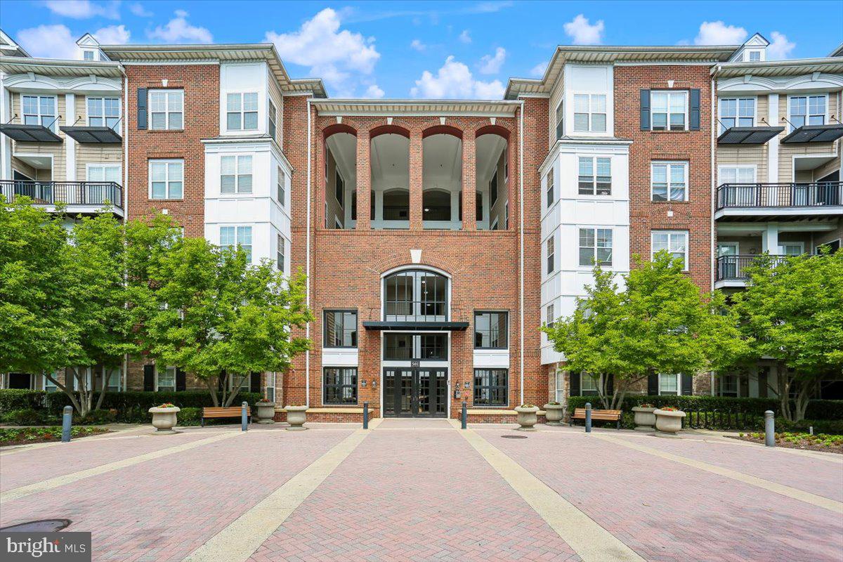 Enjoy a carefree lifestyle at The Fitz, where exceptional amenities and a prime location come together beautifully. This 877 square-foot unit is open and airy, featuring a spacious living room with gleaming wood floors, crown molding, a stylish ceiling fan, and access to the delightful balcony / patio. The living room flows into the gourmet kitchen, complete with granite countertops, tile flooring, a breakfast bar, and a GE Profile stainless steel appliance suite, including a refrigerator, dishwasher, and five-burner gas range.
The generous primary bedroom suite offers wood flooring, a contemporary ceiling fan, a large walk-in closet, and a dual-entry full bathroom with an oversized granite vanity and a tub/shower combination. The unit is complete with an in-unit washer and dryer.
Thoughtful mechanical updates include a 2018 water heater and replacement of the HVAC evaporator coil and compressor, enhancing the home's comfort and reliability.
Life at The Fitz extends far beyond your front door. This sought-after, pet-friendly community offers an exceptional collection of resort-style amenities, including an outdoor swimming pool, fully equipped fitness center, theater/media room, cybercafé, clubhouse, billiards and ping pong lounge, meeting room, and beautifully landscaped courtyard. Basic cable and high-speed internet are included in the condominium fee, adding even greater value and convenience.
This home includes two deeded garage parking spaces, both conveniently located on the same level as the unit, making everyday living and unloading groceries effortless. An additional deeded heated storage unit (S10) provides valuable extra storage.
Ideally situated just moments from Rockville Town Center, the Rockville Metro and MARC Train, residents enjoy exceptional walkability to an array of restaurants, cafés, shops, grocery stores, entertainment venues, and the popular seasonal farmer’s market. With easy access to I-270, Route 355, and major commuter routes, The Fitz perfectly blends urban convenience with a welcoming community atmosphere. Freshly painted, amenity-rich, and ideally located, this home offers an outstanding lifestyle in the heart of Rockville.