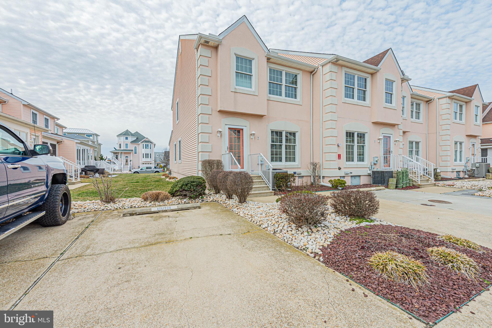 Welcome to 13487 Bella Vista Ln in the charming water-access community of Portofino, ideally located just off Route 54 and only about a mile from the beaches of Ocean City and Fenwick Island. This beautifully maintained 3-bedroom, 2.5-bath coastal townhome offers the perfect combination of comfort, convenience, and coastal lifestyle. 
The open and inviting main level features a spacious living area with a cozy fireplace, flowing seamlessly into the dining space and kitchen, perfect for entertaining family and friends. Upstairs, you’ll find three generously sized bedrooms including a private primary suite, along with two full bathrooms and convenient laundry area.
Enjoy additional living space in the bright sunroom, ideal for relaxing year-round or hosting guests. Step outside to enjoy the community pool or unwind on your private patio after a day at the beach.
