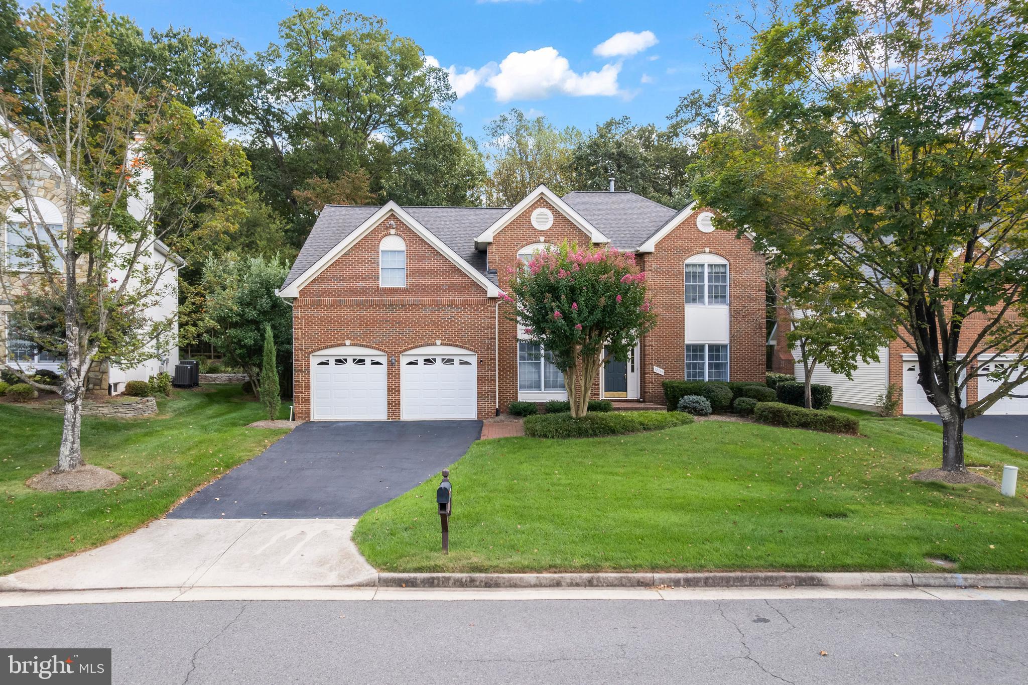 This stately home, featuring an open-concept kitchen, family room, and sunroom, serves as a true private haven. The first floor opens to a soaring double-story foyer and a private study accented by elegant French doors. A large mudroom and laundry combination provides a seamless transition from the garage to the main living areas. 

The heart of the home is bathed in natural light and anchored by a stone hearth fireplace that soars to the second level, creating a stunning focal point for the family room. The gourmet kitchen is a chef’s dream, boasting beautiful stone counters, a multi-burner gas cooktop, double ovens, and custom wood cabinetry.

Navigating the home is effortless with two sets of stairs: a beautifully angled formal front staircase and a convenient back stair leading from the family room to the bedroom level. Upstairs, the primary suite offers a peaceful sitting area and an expansive walk-in closet. The renovated en-suite bathroom is a masterpiece, featuring double vanities, a spacious walk-in shower, a large soaking tub, and integrated speakers from the home’s comprehensive sound system. The second bedroom also includes a walk-in closet and private en-suite, while the third and fourth bedrooms share a bath with recently updated fixtures.

The lower walk-out level is designed for ultimate entertainment, featuring a wet bar and a private cinema with theater seating and sound-dampening panels. This level also includes a recreation room, an exercise room or office, and a fourth full bathroom with easy access to the backyard.

Step outside to your private retreat: a shimmering heated pool set against a backdrop of mature trees. The multi-level flagstone terrace features a dedicated grilling station and ample room for play or relaxation. With the lower-level bathroom easily accessible, poolside entertaining is effortless. The lawn even waters itself with installed Sprinklers. V.A. Assumable loan available.   This home is a true haven of sophistication and comfort—not to be missed.