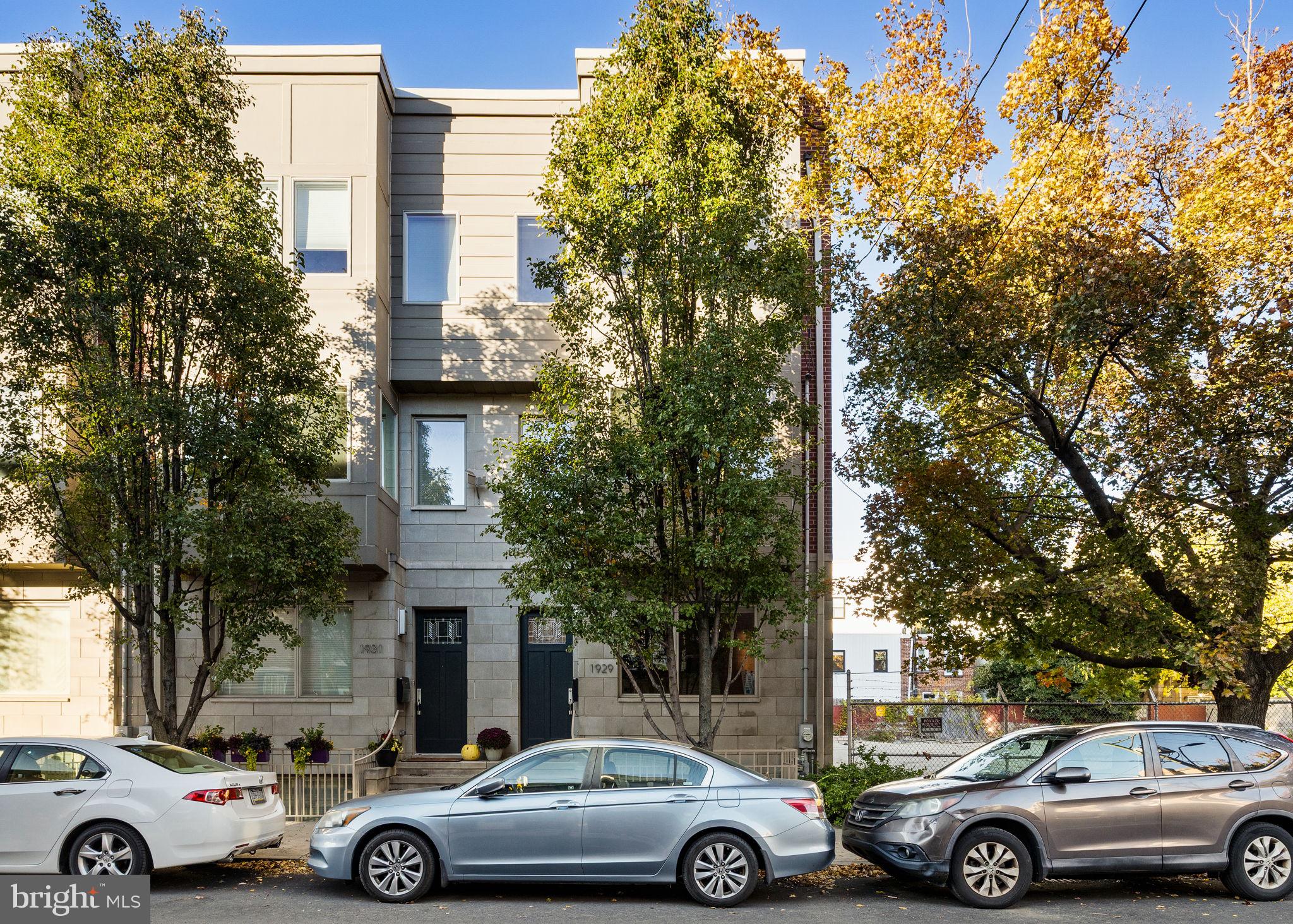 Welcome to 1929 Fitzwater St, a stunning 3-bedroom, 3-bathroom residence offering 3,048 square feet of sophisticated living space in the heart of Graduate Hospital. This modern home perfectly blends luxury with city convenience, featuring that rarest of Philadelphia treasures: a private 1-car garage with direct indoor access.

Step inside the foyer to find a versatile first-floor bedroom suite with a full bath—perfect for guests or a home office—that leads directly to your private rear driveway and garage entrance. Ascend to the main living level, where high ceilings and an open-concept floor plan create an airy, sun-drenched atmosphere. The gourmet kitchen serves as the heart of the home, anchored by a massive center island with bar seating, granite countertops, and stainless steel appliances, all flowing seamlessly into the spacious dining and living areas.

The third floor is dedicated to relaxation, housing a conveniently located laundry area, a spacious guest bedroom with an adjacent full hall bath, and the expansive primary suite. The primary retreat spans the width of the home and features generous closet space alongside a spa-inspired private bathroom. Continue upward to the crown jewel of the home: a magnificent 33-foot rooftop deck offering unobstructed, panoramic views of the Center City skyline—the ultimate backdrop for entertaining.

The residence is completed by a fully finished lower level featuring a sprawling living area ideal for a media room or gym, plus a massive dedicated storage room. With dual-zone HVAC, hardwood flooring throughout, and a location just steps from Julian Abele Park, Pub & Kitchen, Loco Pez, and a short walk to Rittenhouse Square, this property offers the absolute best of city living.
