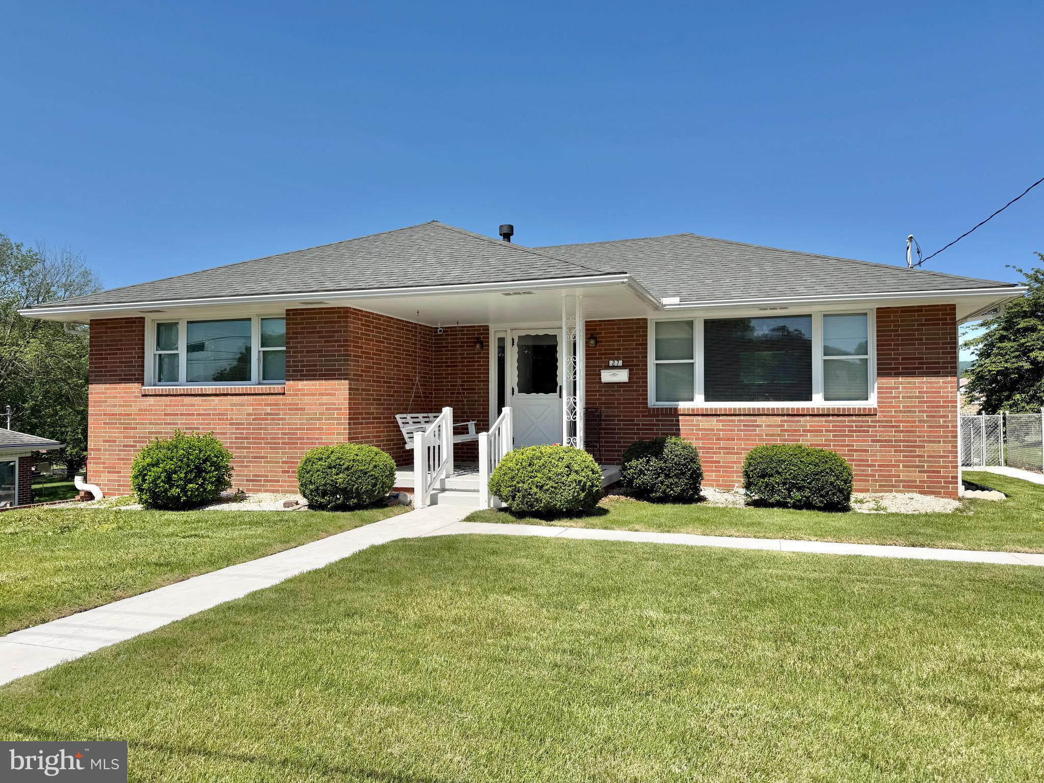 Welcome home to this meticulously maintained brick ranch home nestled in the heart of Cumberland with .50-acre lot! This charming property offers everything today's buyers are looking for, including 3 bedrooms, 2 full bathrooms, a fenced rear yard, and a spacious rear porch showcasing some of the area's most beautiful views.

Step inside and discover a home that has been lovingly cared for over the years. The primary bedroom features two closets, providing ample storage, while hardwood floors lie beneath the living room carpet, offering exciting potential for future updates. A one-car garage conveniently located beneath the rear porch adds extra storage and functionality.

The lower level provides additional living space and flexibility, featuring a bedroom, a full bathroom with a beautifully hand-tiled shower, and plenty of room for guests, recreation, or a home office. 

Major systems have been well maintained, including a furnace that has been serviced annually, a roof that is approximately 10 years old, and 18 inches of attic insulation to help enhance energy efficiency and year-round comfort. The home is also equipped with 200-amp electric service.

As an added bonus, the seller is willing to include the furnishings, making this a truly move-in-ready opportunity. With its thoughtful updates, exceptional maintenance, fenced backyard, and stunning views from the rear porch, this Cumberland gem is ready to welcome its next owner. Don't miss your chance to make it yours!