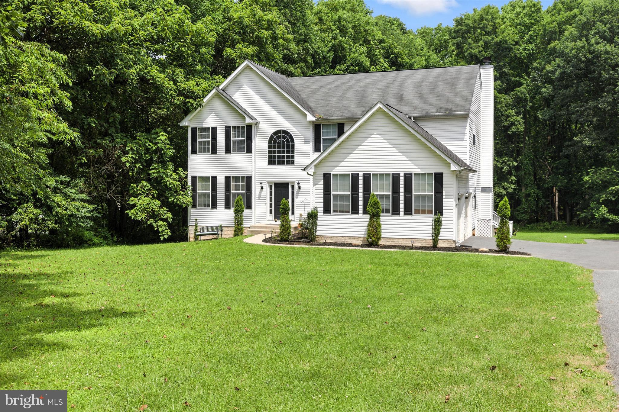 Price refinement on this  beautiful colonial home in Reisterstown with over 3.0 acres of secluded land. that offers an abundance of natural beauty and wildlife. Many updates include, new well pump 2 years, Vivint alarm system, expanded  driveway, new garage door openers 3 years, new washer & dryer, new dishwasher (to be installed), built-in shelving. Main Level features formal living and Dining rooms, updated airy kitchen with center island and granite counter tops, ceramic tile flooring, opens to an inviting family room with wood burning fireplace, there is also a private main level office. Upper level offers a chic primary suite with ample closet space and updated bath. 3 additional spacious bedrooms and full bath. The fully finished lower level offers an exercise room, bright over-sized family room with another full bath and outside entrance. There is a side load 2 car garage with built-in shelving for storage, trek deck along the entire rear of home over looking the expansive back yard, a nature lovers dream!