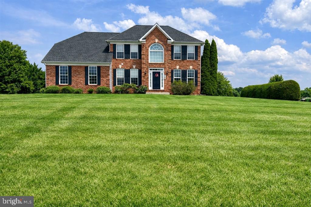 Rare opportunity in coveted Grace-Lyn Manor — a distinguished Custom Brick Colonial set on a gorgeous, flat 1.12-acre lot where timeless craftsmanship meets head-to-toe, move-in-ready luxury. 2521 Karen Way stands apart from every other home on the market: substantial all-brick facade, three finished levels including a full basement with exit, and an ownership team that has invested heavily and thoughtfully in every major system and finish since 2019. This is the home that discerning buyers wait years to find.
Step inside and the open floor plan immediately impresses — Wide plank hardwood like floors anchor the main level while a spacious kitchen with a large center island invites both everyday living and effortless entertaining. The kitchen is equipped with a whole-home reverse osmosis water filtration system at the sink and the refrigerator, delivering pure, clean water on demand. The adjacent dining and living rooms feature elegant crown molding and chair railings, and a dramatic fireplace with glass doors and custom mantel creates a warm, refined focal point. Need a dedicated workspace? The home office with French doors offers the privacy and polish that todays buyer demands.
Every major upgrade has already been done for you. The sellers have spared no expense: a new HVAC system, new hot water heater, new pressure tank (well system), and a septic system pumped and fully serviced ensure complete peace of mind. The exterior transformation is equally impressive — new siding, new shutters, and a widened driveway create striking curb appeal, while refreshed landscaping frames the property beautifully. New carpet has been installed in the family room, and new hardwood laminate flooring delivers a fresh, sophisticated look on the main level. And the roof? A 50-year architectural roof installed in 2015 — just approximately 10 years old with more than 40 years of life remaining — is the kind of asset that home inspectors and buyers alike celebrate.
Upstairs, the primary suite is a true retreat: cathedral ceilings soar overhead, a generous walk-in closet satisfies even the most demanding wardrobe, and the private en-suite bath provides a spa-like escape. Three additional bedrooms share a well-appointed full bath, and the bedroom-level laundry — rare in this price range — eliminates the daily stair trek that plagues so many homes. The basement spans the entire footprint of the home, offering unlimited potential for a recreation room, home gym, the band, or additional finished living space.
Outside, the maintenance-free oversized deck and paver patio with outdoor lighting create an al fresco living experience perfectly suited to the flat, private 1.12-acre backyard. A storage shed adds practical utility, and the side-facing two-car attached garage completes the picture of a home that has everything. Two-hundred-plus-amp electric service, double-pane vinyl-clad windows, recessed lighting, ceiling fans, and a bay window with a motorized shade feature to block the afternoon sun round out a feature list that is genuinely difficult to match at this price point.
Located in the highly sought Grace-Lyn Manor neighborhood, residents enjoy proximity to Deer Park fields and walking paths — Westminster living at its finest. Zoned for top-performing schools including Mechanicsville Elementary (rated A-), Westminster West Middle, and Westminster High, the location is as strong as the home itself. And with no HOA fees or restrictions, your freedom comes standard.
The Westminster market is extraordinarily competitive — homes are going under contract in an average of just seven days, and nearly half of all homes sell above asking price. 
At $749,000, this exceptional Brick Colonial with 1.12 acres, all-new mechanical systems, and a 40-plus-year roof represents genuine, documentable value. Showings are expected to fill immediately — schedule yours today and bring your best offer.