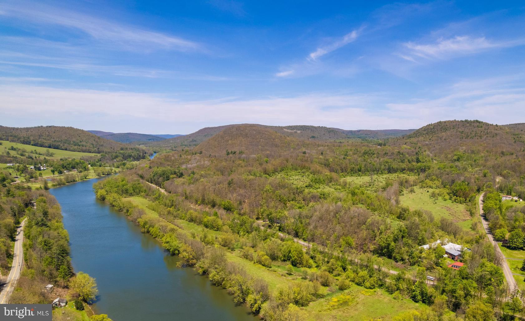 🌾 A TRUE FARM‑TO‑TABLE LIFESTYLE AWAITS 🌾

Start living the farm‑to‑table dream on this gorgeous 15‑acre farm (with more acreage available) set along the iconic Susquehanna River in beautiful Susquehanna County. This is the kind of property people wait years to find—rolling hills, fertile ground, river frontage, and a lovingly maintained 1900 farmhouse that radiates charm, history, and pride of ownership.

Once home to 100 dairy cows and 20,000 chickens, this farm is perfectly set up for anyone looking to revive a working operation, start a homestead, or simply enjoy the peace and privacy of country living. The land is a blend of open fields, wooded sections, and meandering trails where cattle once roamed. Many acres were historically tillable or hayed, especially the rich soils bordering the river—ideal for gardens, livestock, orchards, or small‑scale agriculture.

With over 2,000 feet of Susquehanna River frontage, you’ll enjoy endless recreation: fishing, kayaking, boating, wildlife watching, and the kind of sunsets you never forget.

The 2,854 sq. ft. farmhouse is in excellent condition, offering 5 bedrooms, 1 bath, and a long list of thoughtful upgrades over the past two decades:
• New metal roof (2008)
• New chimney flashing
• New furnace  
• Updated kitchen wall & door
• Wood floors upstairs
• All new well piping (2022)
• New hot water heater
• Pella windows (approx. 10 years old)

A propane fireplace insert adds warmth and convenience (tank is rented). The property is enrolled in Clean & Green, and all OGMs convey—with an active lease beginning in 2025 and a 5‑year extension option, offering potential future royalties.

Whether you dream of farming, homesteading, raising animals, creating a family compound, or simply escaping to a peaceful riverfront retreat, this property delivers it all.

SELLER WILL FINANCE WITH 20% DOWN!  
Opportunities like this are rare—schedule your private tour today.