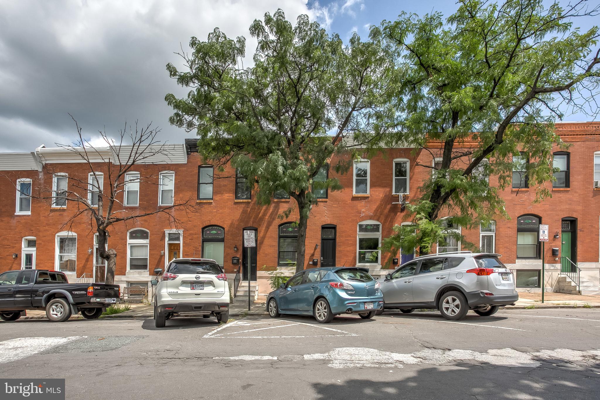 This 1 year old renovation has it all!  4 Bedrooms - 3.5 bathrooms - incredible rooftop deck - fully finished basement & PARKING!!  Beautiful hardwood floors throughout the wide open main level.  Incredible modern kitchen. Easy parking on super wide alley.    The lower level features 2 large rooms and a full bath in between.   Perfect for roommates, office, additional family room or storage.  Upstairs includes Bedrooms each with their own full bathrooms and hallways access to the rooftop with 360 degree city skyline views!