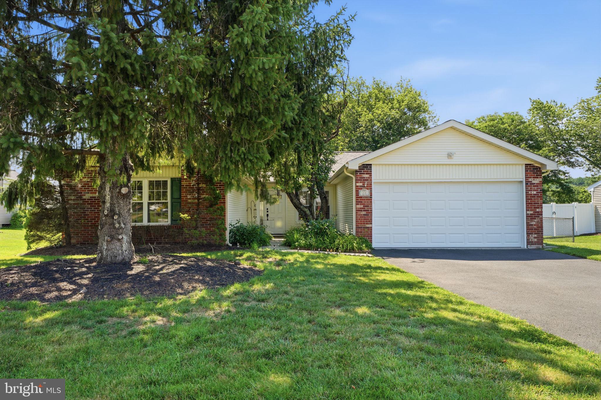 Welcome to this beautiful, completely upgraded ranch-style home nestled in the highly desirable Newtown Crossing neighborhood! Boasting an effortless layout and a completely move-in-ready interior, this property offers the perfect blend of modern comfort and serene living within the top-rated Council Rock School District.

Step inside the inviting open foyer to find a bright living room flooded with natural light from large windows. The seamless open-concept dining area flows effortlessly into a fully updated gourmet kitchen, complete with stainless steel appliances, premium granite countertops, and elegant tile flooring. High-end luxury vinyl plank flooring stretches across the main living areas, leading you into a cozy family room centered around a warm fireplace—perfect for relaxing evenings. From the family room, step outside through the sliding doors to your private, covered deck overlooking a peaceful, fully fenced-in backyard.

The thoughtful single-level floor plan features a private bedroom wing on the left side of the home, offering three spacious bedrooms. The primary suite includes its own dedicated full bathroom, while the remaining two bedrooms share a beautifully appointed full hall bath. For ultimate convenience, a dedicated main-floor laundry room comes equipped with a newer washer and dryer.
Substantial 2025 Upgrades & Major Systems Include:
Brand New A/C & Hot Water Heater (Installed 2025)
Newer Heating System
Full Basement Waterproofing & New Sump Pump (2025)
Professional Landscaping (2025)
Updated Roof (Installed 2025 by the prior owner)
Energy Efficiency Bonus: The home features leased solar panels, offering the incoming buyer excellent energy efficiency and substantial savings on monthly electric bills!

An expansive full footprint basement awaits, providing a completely dry, blank canvas ready to be finished to your exact preferences. Parking and storage are a breeze with the attached 2-car garage, which features integrated built-in storage space.

Residents of Newtown Crossing enjoy fantastic community amenities, including a neighborhood pool, alongside incredibly convenient access to historic Newtown shopping, premier dining, and major commuter highways. Don't miss the opportunity to own a fundamentally brand-new feeling home in an unbeatable location!